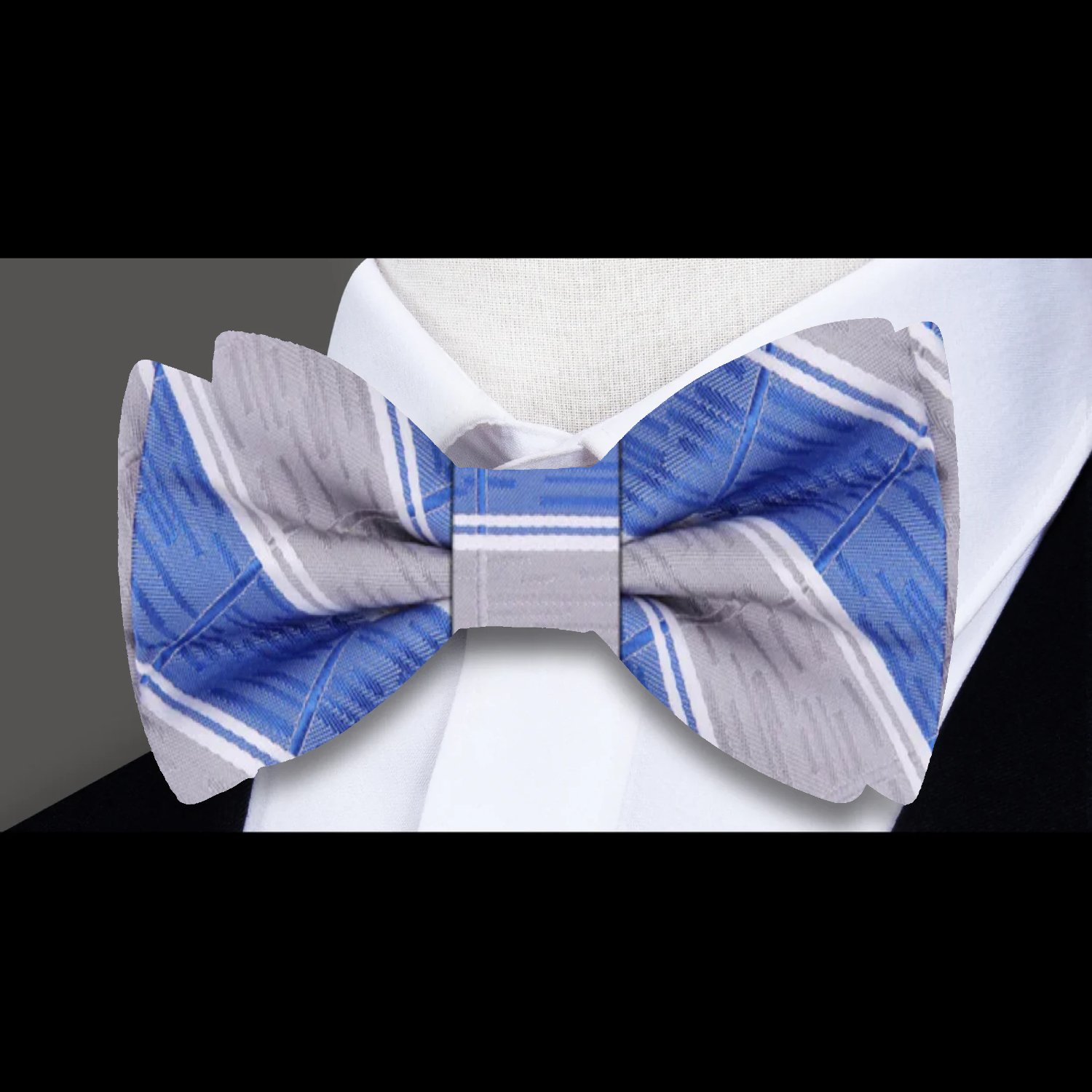Styled with a white dress shirt and navy suit, demonstrating its versatility for formal events.