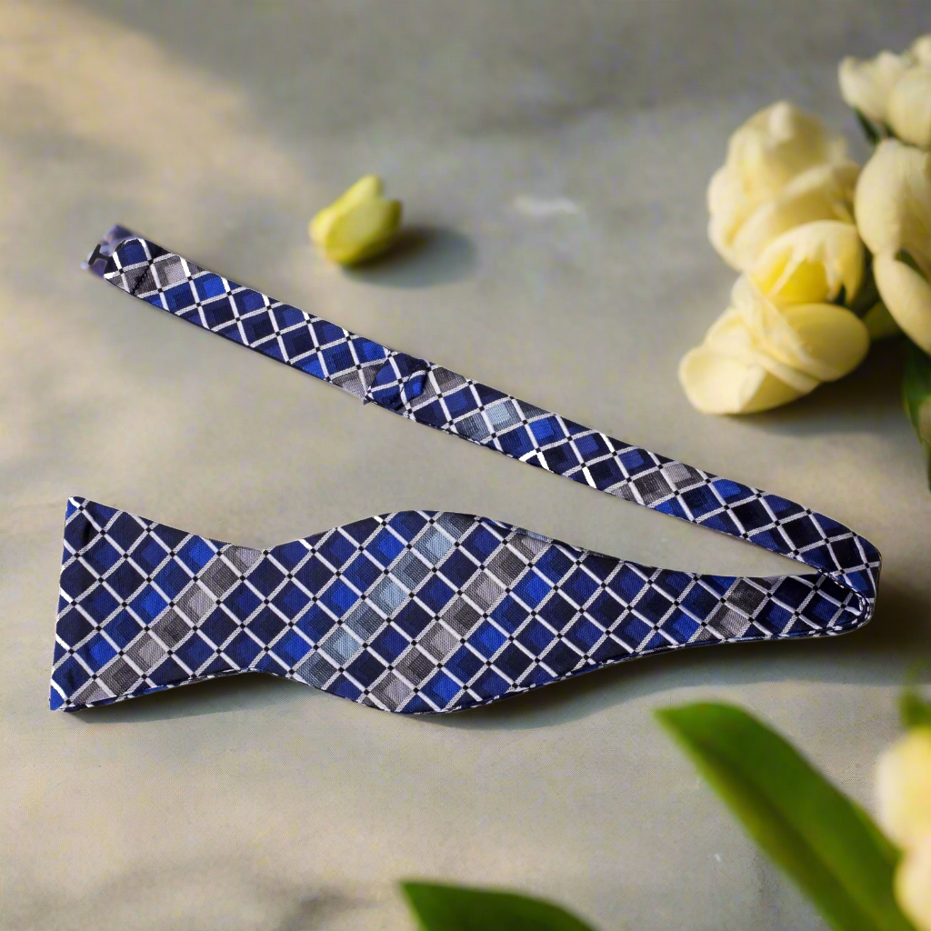 Model wearing the self-tie bow tie with a classic suit at a wedding