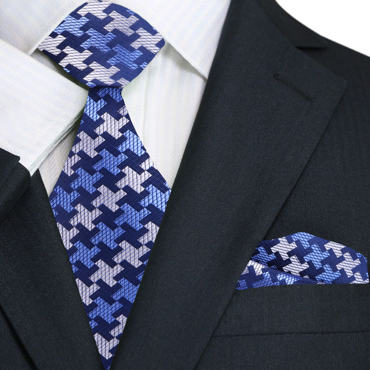 Man wearing a houndstooth silk dress tie with a navy suit for a business conference