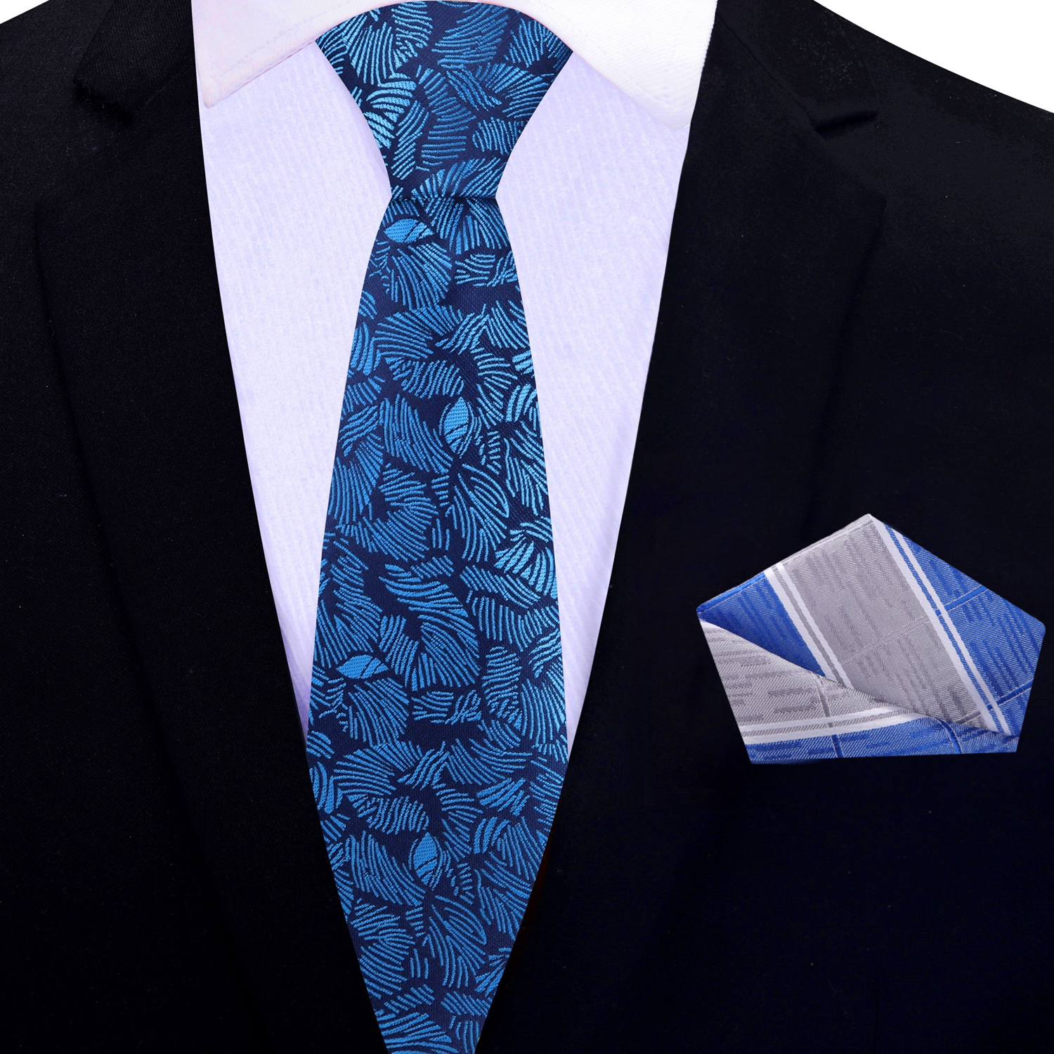 Man wearing a silk tie with tropical design at outdoor garden party