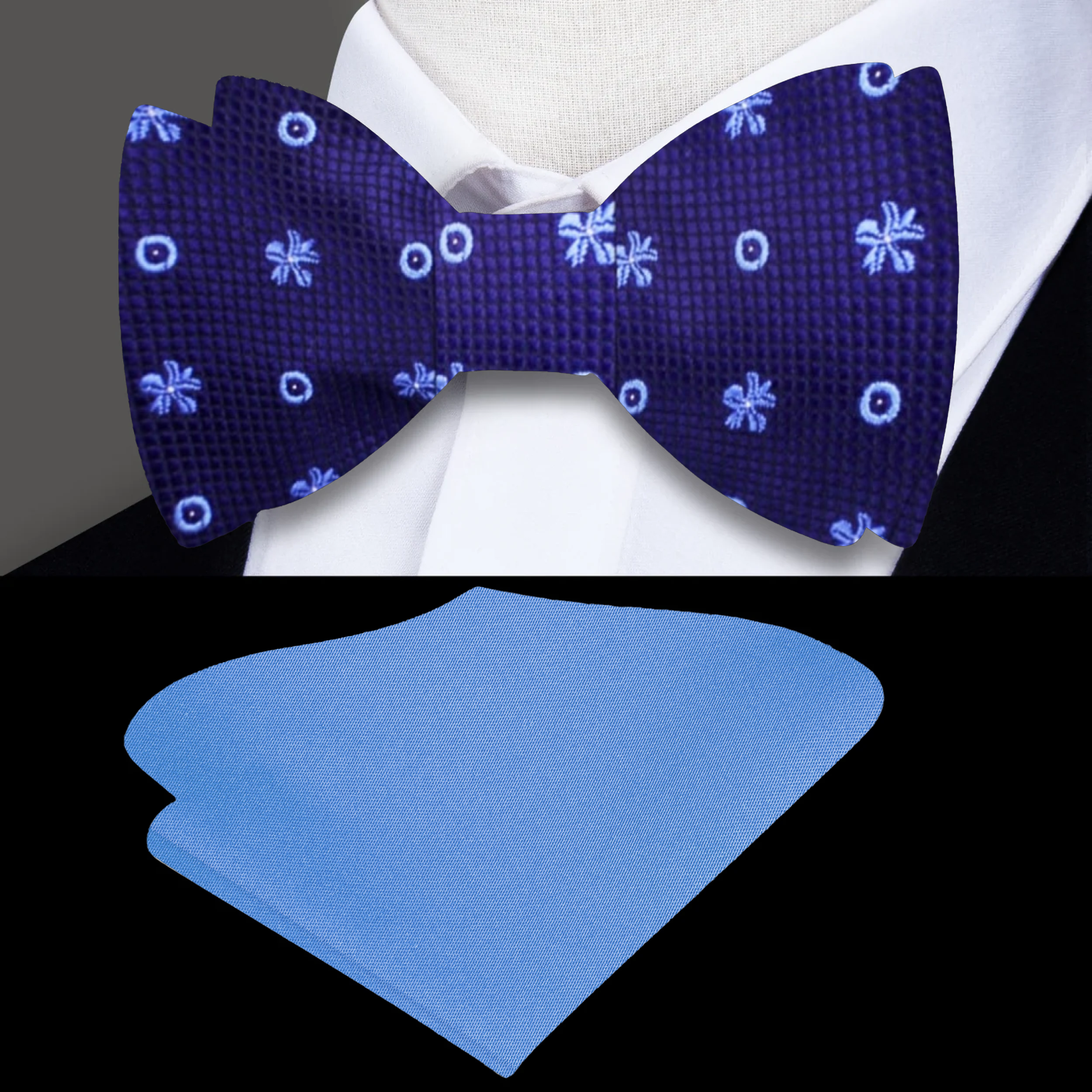 Elegant Dark Blue Floral Self-Tie Bow Tie displayed on a wooden table, highlighting its intricate flower pattern.