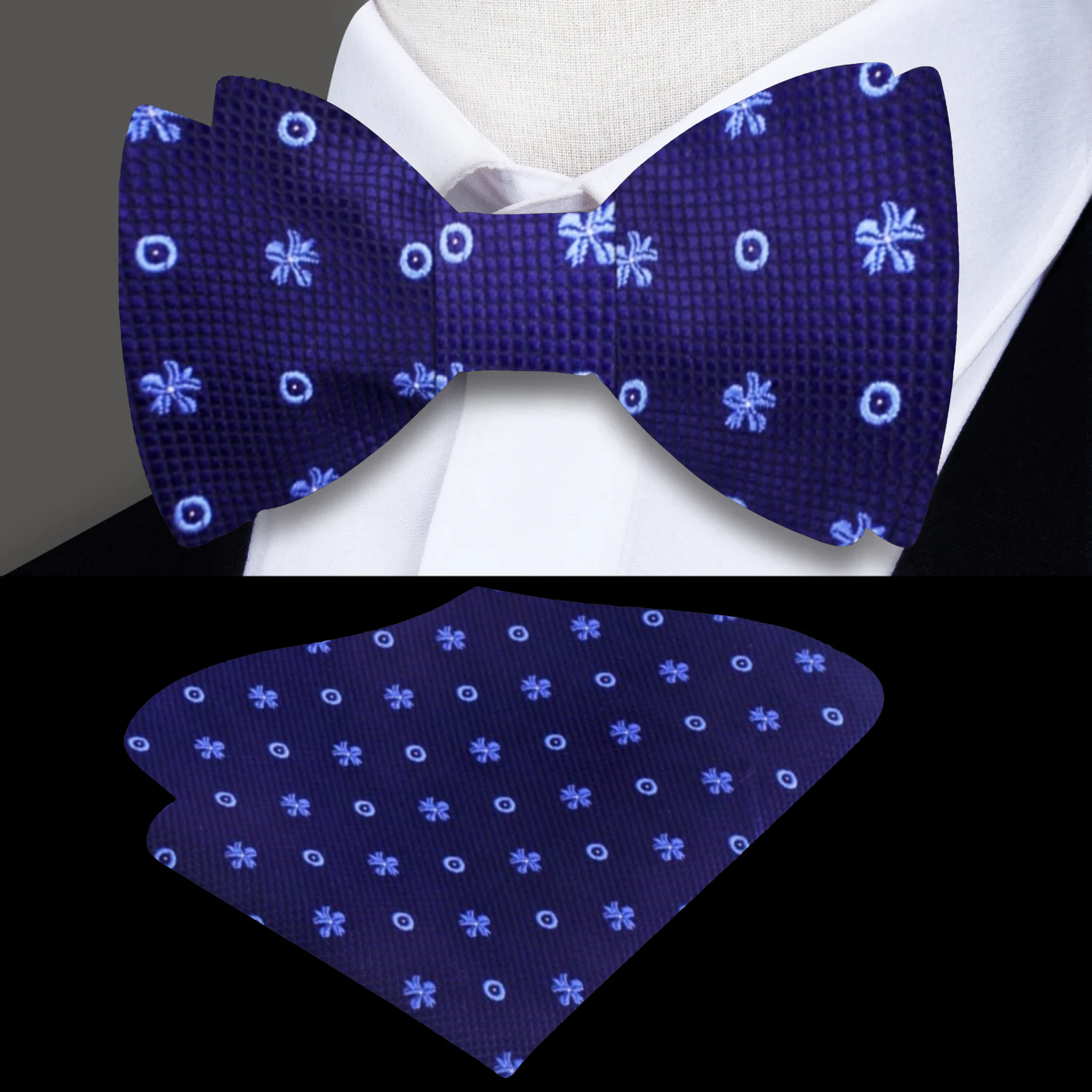 Close-up of the handmade self tie bow tie for men, featuring vibrant light blue flowers on a dark blue background.