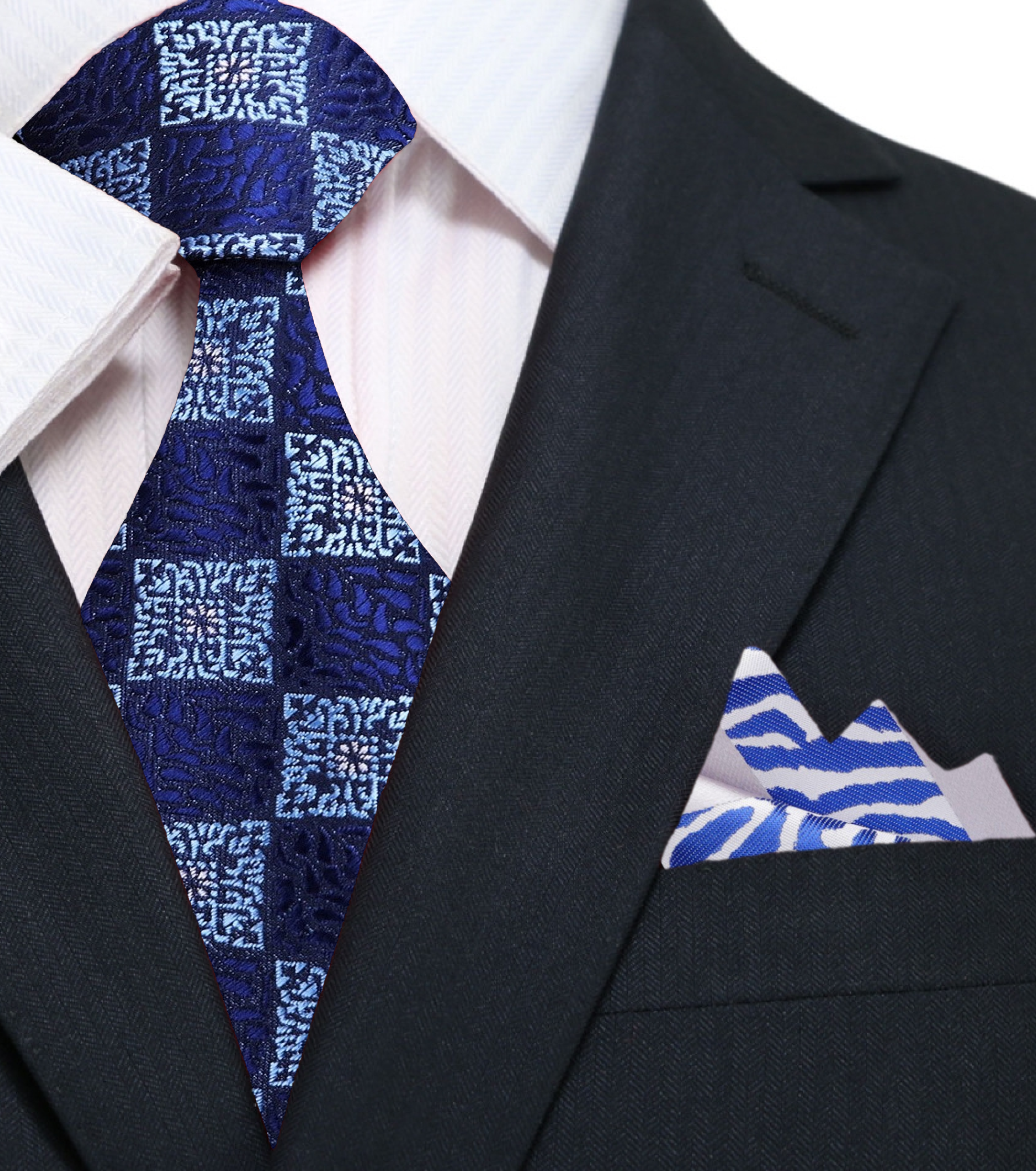Man wearing geometric blue tie with a charcoal grey suit at a business meeting