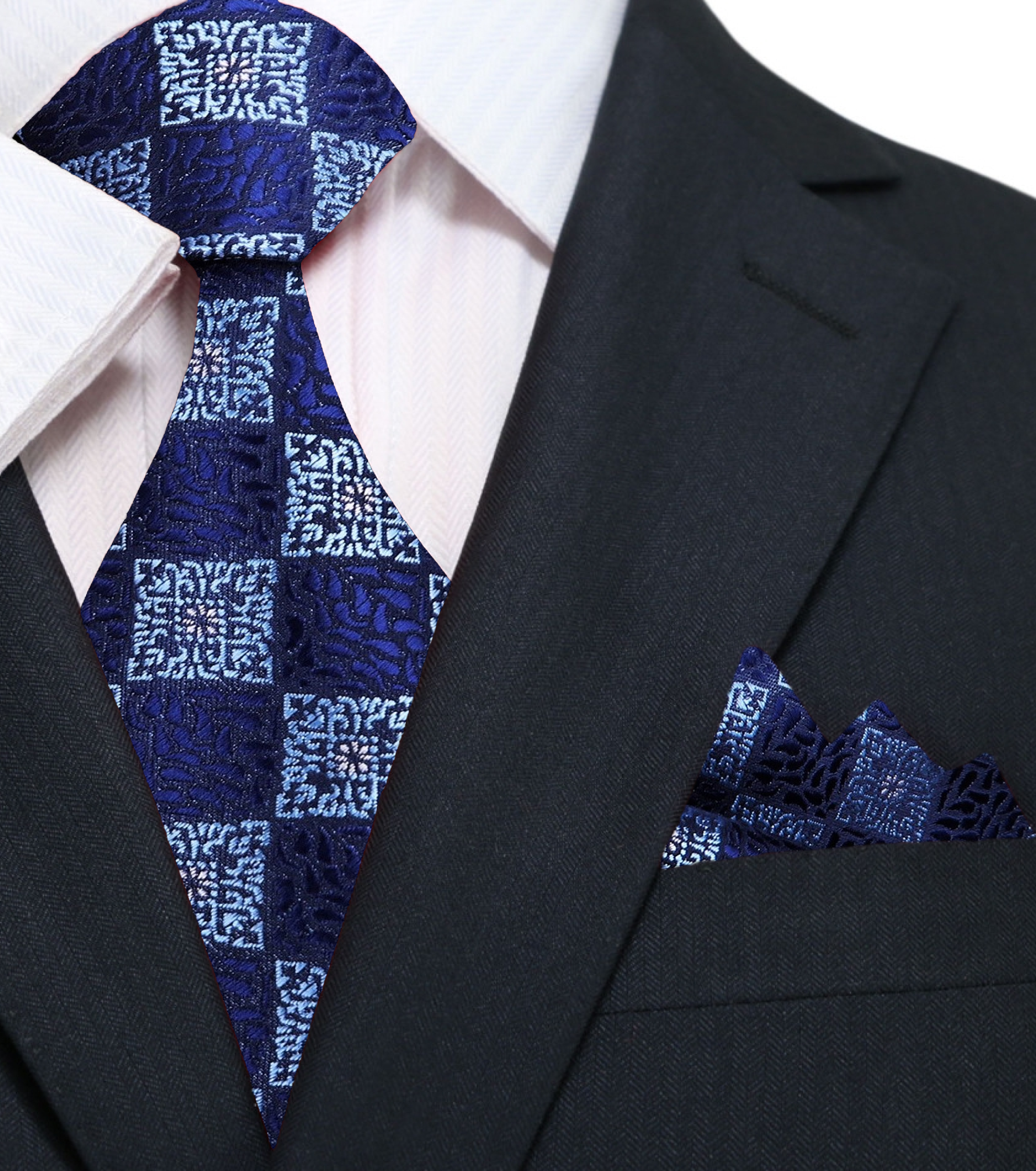 Man wearing geometric blue tie with a charcoal grey suit at a business meeting