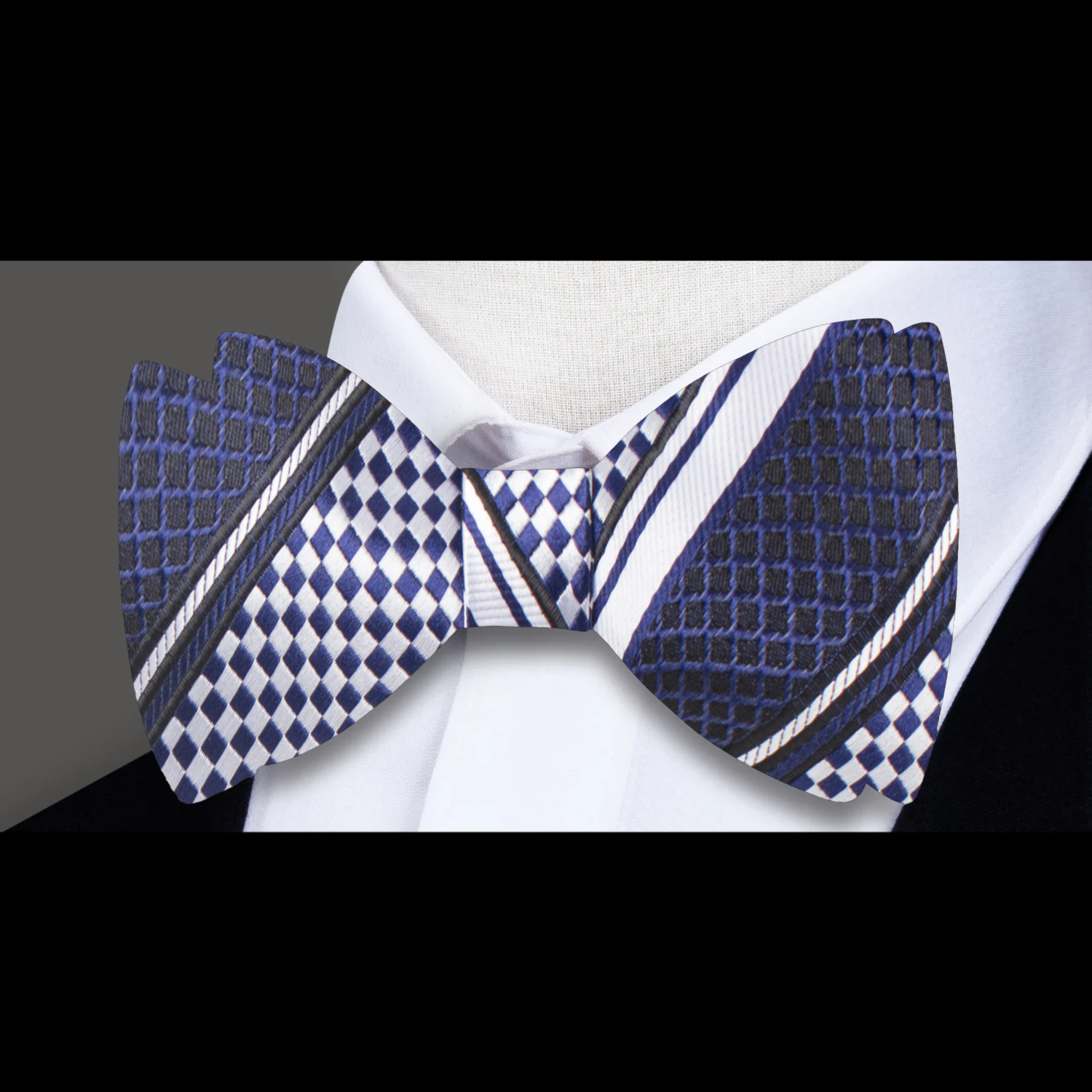 Men wearing a silk bow tie with a formal suit at a wedding