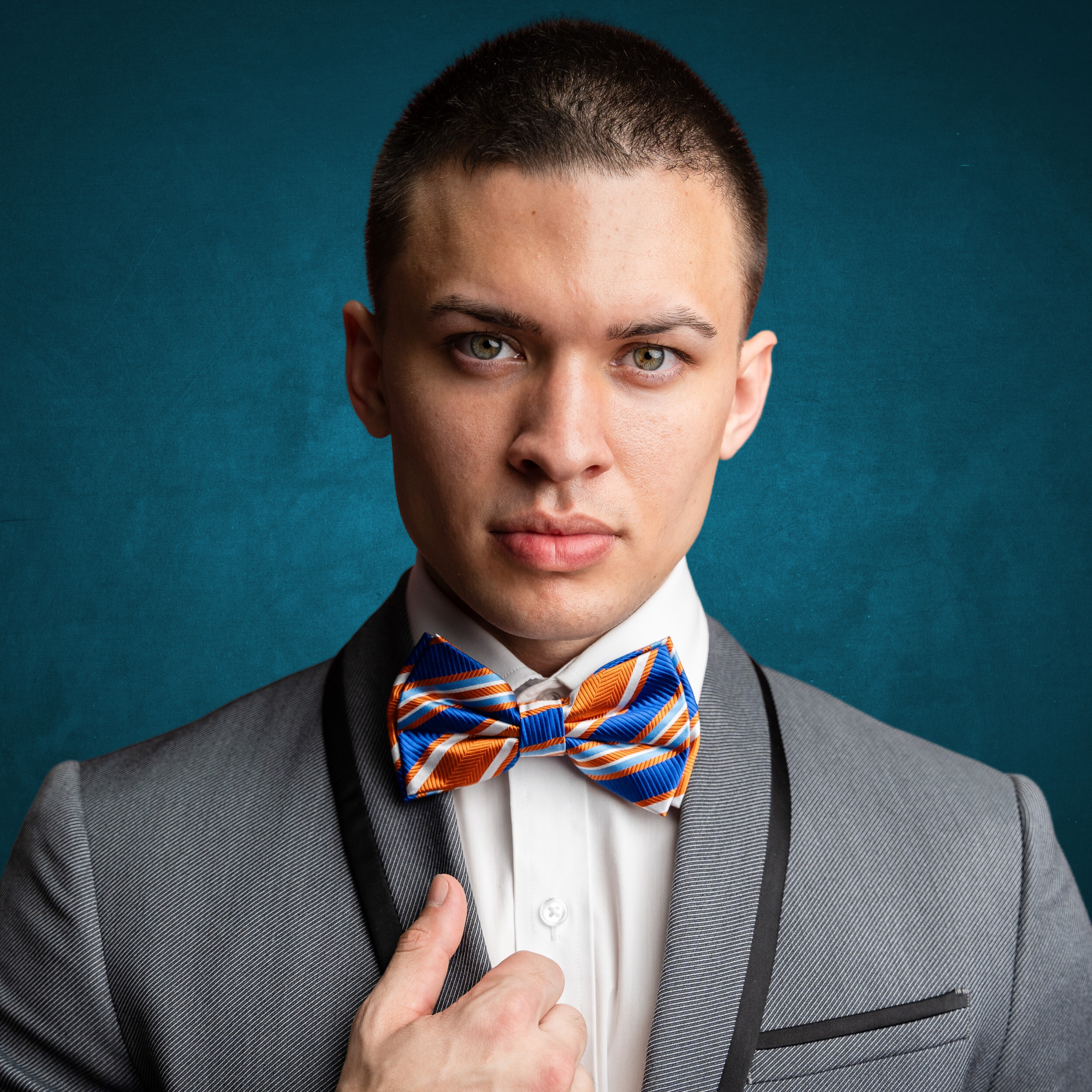 Elegant Delta Stripe Bow Tie in black and red, showcasing its luxurious silk texture.