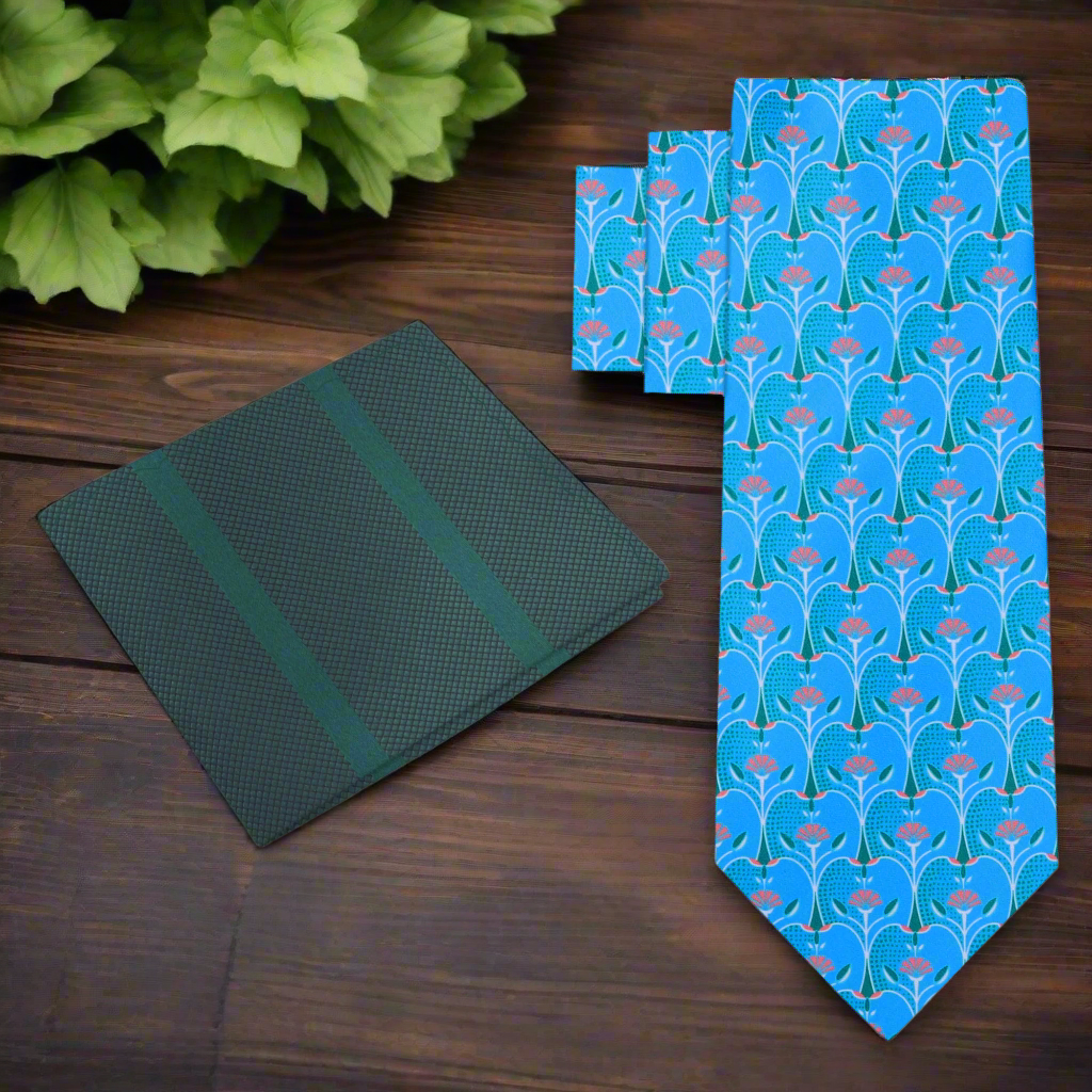 Light blue necktie featuring orange and green apple slice pattern, ideal for summer weddings.