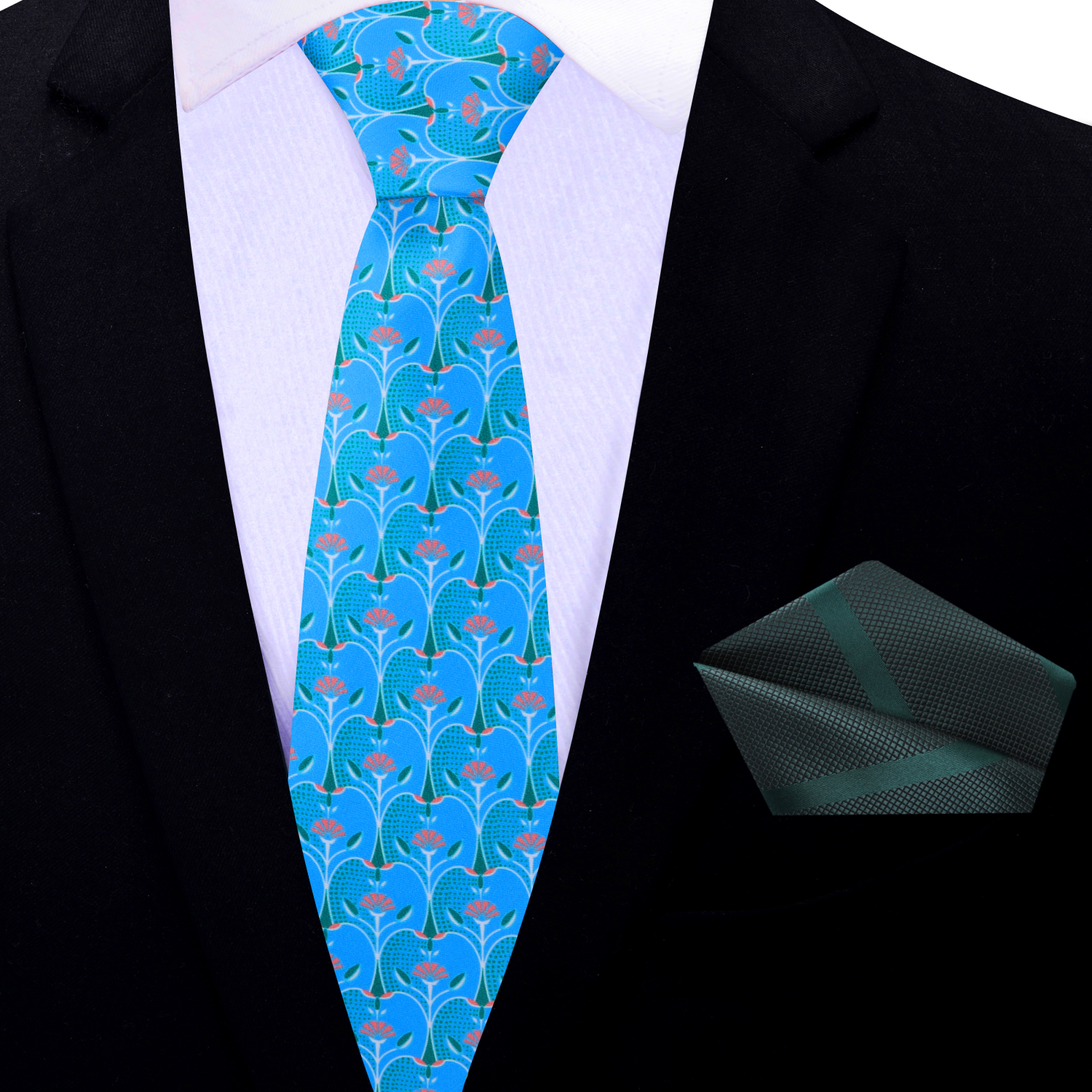 Model wearing the light blue apple slice necktie paired with a crisp white shirt and navy suit.