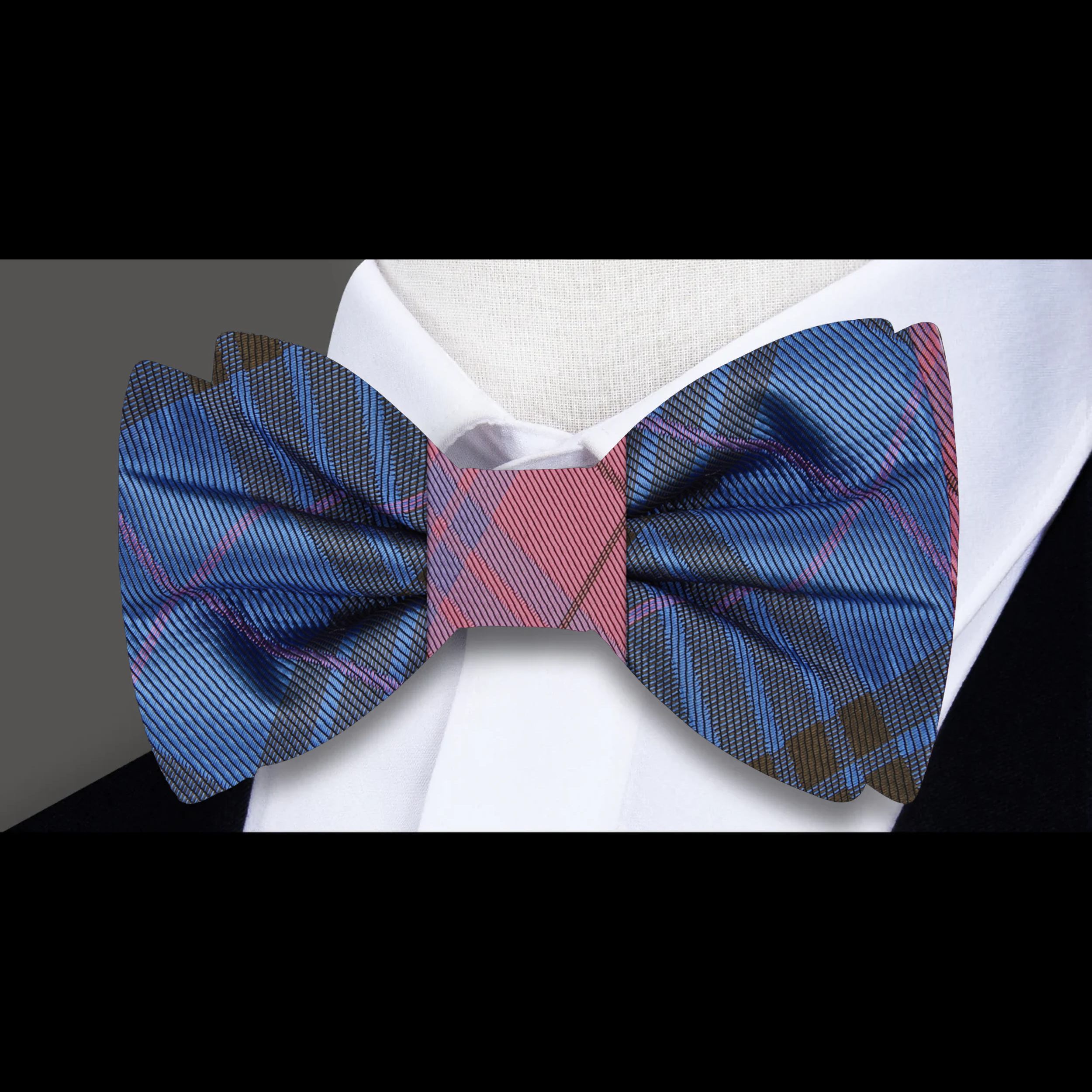 Man adjusting a pre-tied reversible silk bow tie for formal event