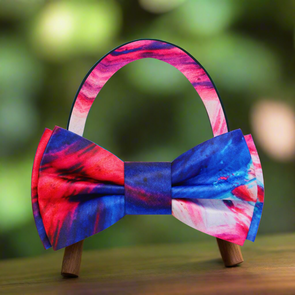Close-up of the blue and pink watercolor silk bow tie showing its luxurious fabric and craftsmanship.