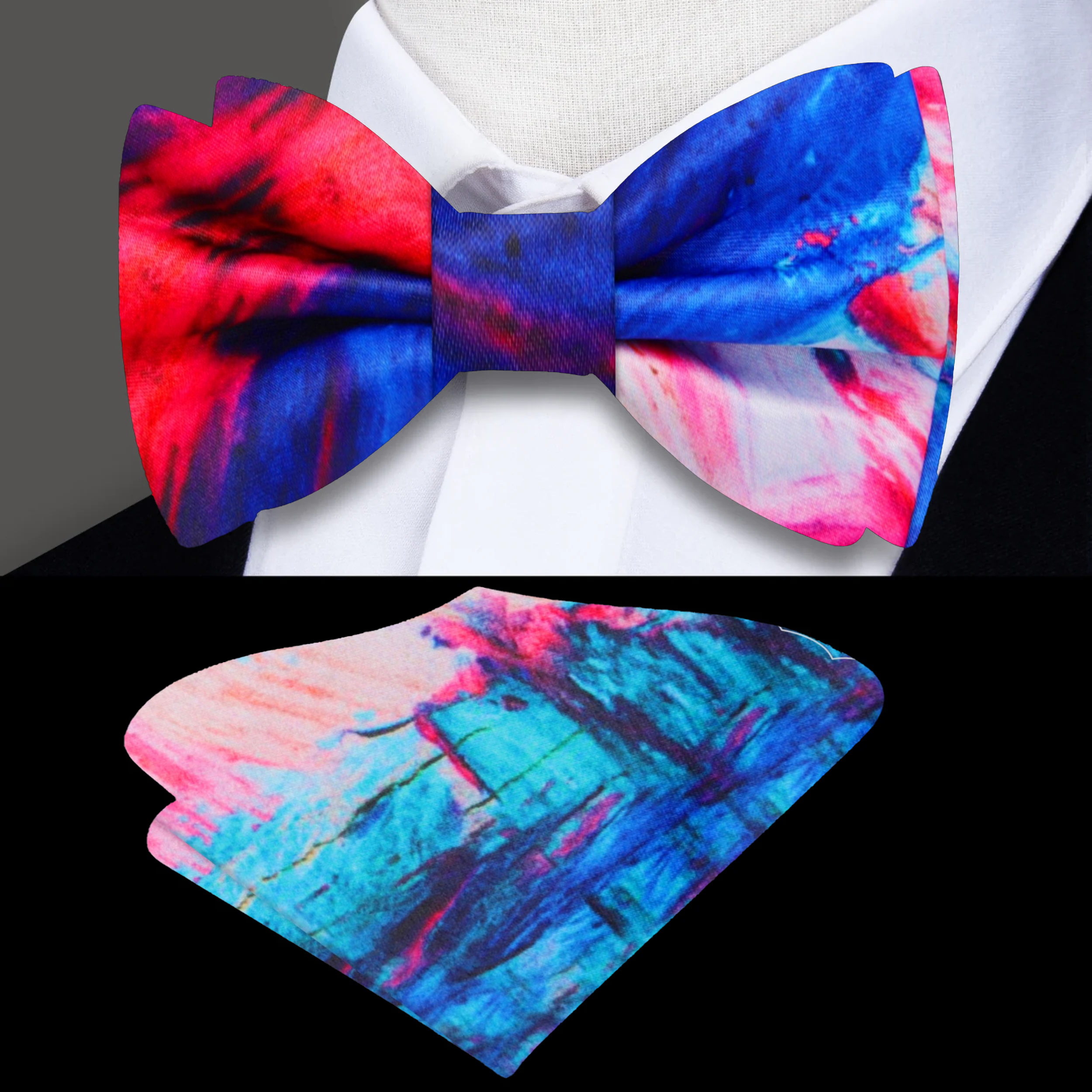 Blue and pink watercolor silk bow tie displayed against a white background, highlighting its artistic pattern.