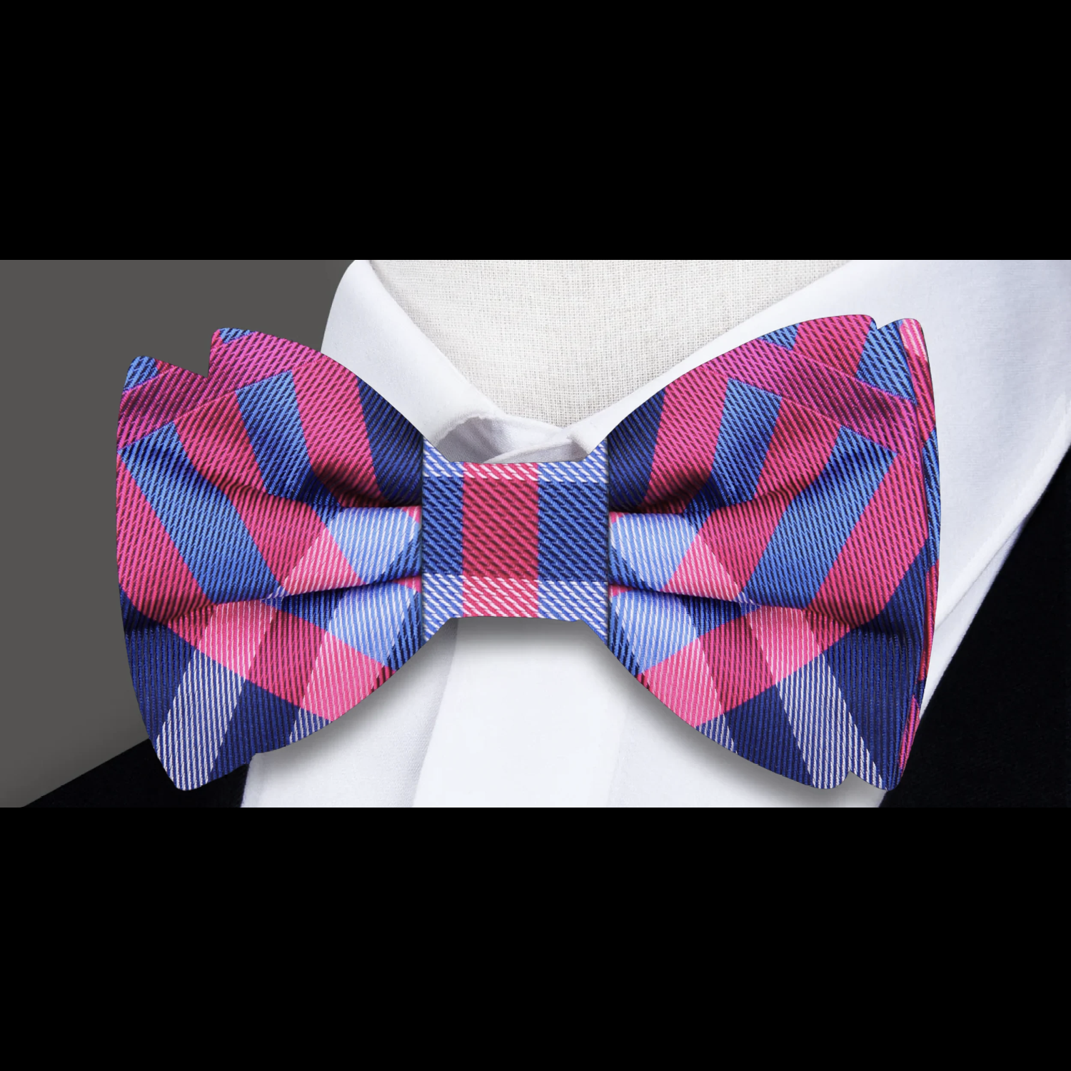 Close-up of a silk plaid bow tie showcasing its elegant pattern and texture.
