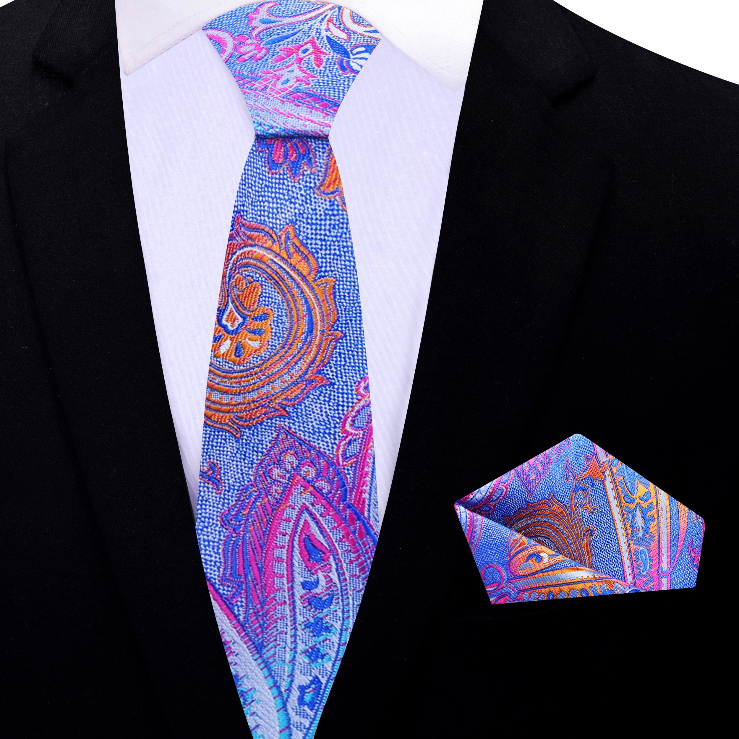 Vibrant paisley silk necktie paired with a navy blue suit.
