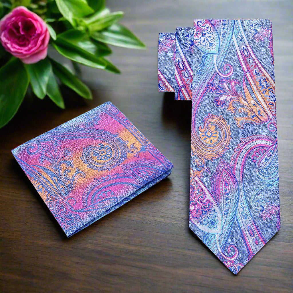 Vibrant paisley silk necktie displayed on a white dress shirt.