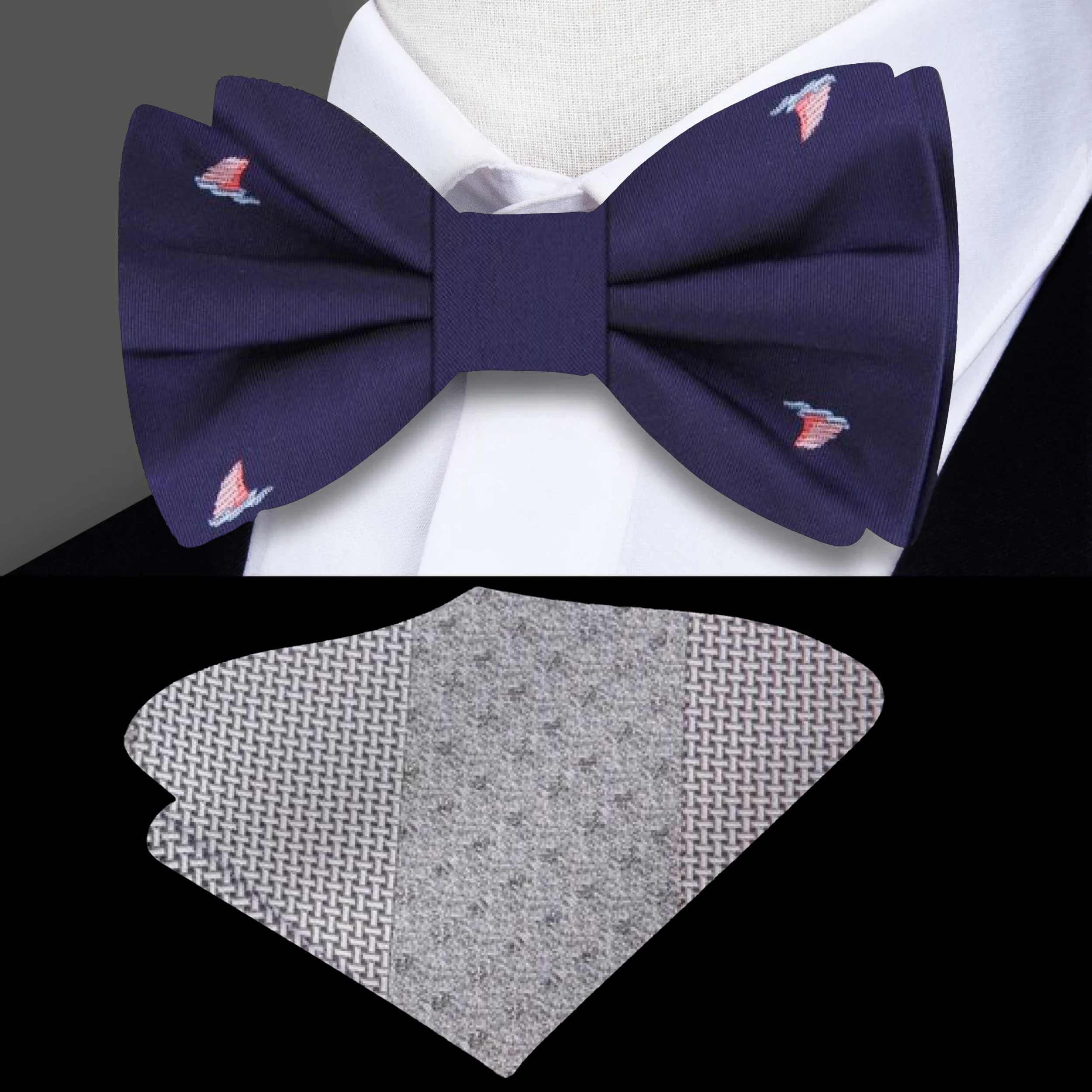 Front view of the Nautical Whimsy Shark Fin Bow Tie showcasing its pink shark fins pattern on a dark blue background.