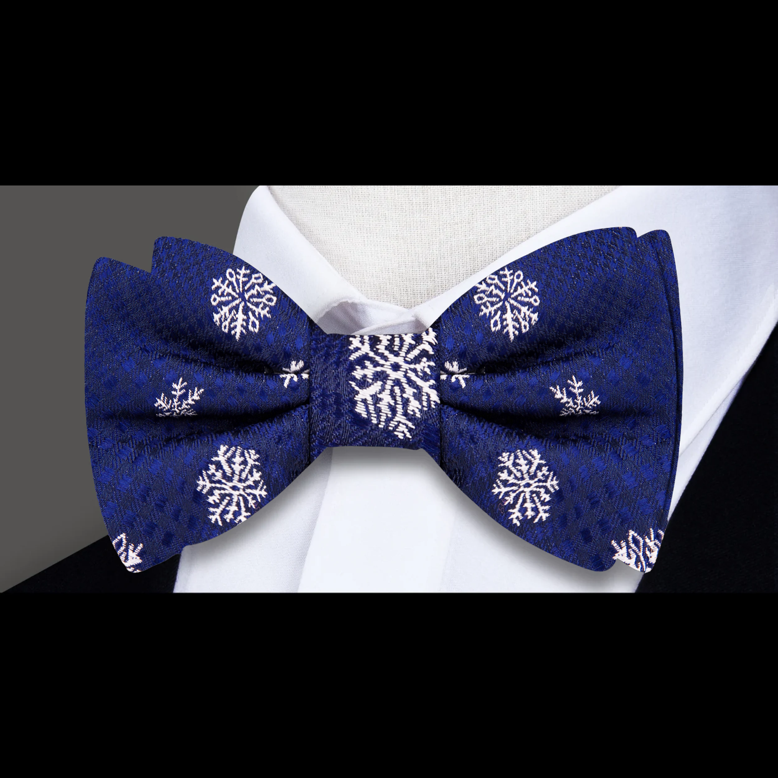 Close-up of the Midnight Snowfall Plaid Bow Tie showing detailed snowflake pattern and silk texture