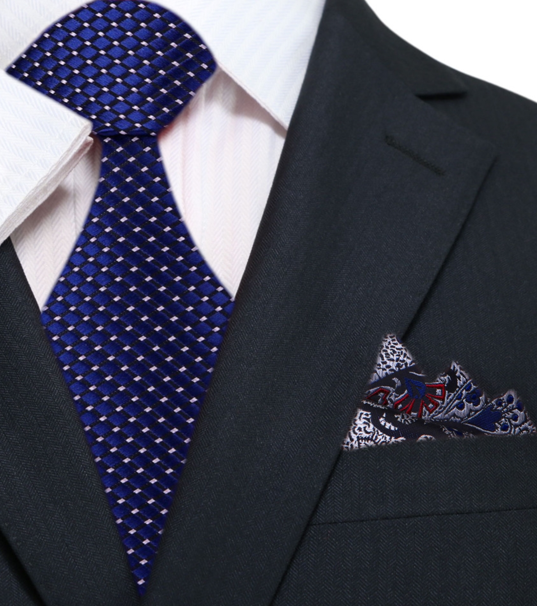 Silk tie with geometric pattern and metallic finish draped over a suit