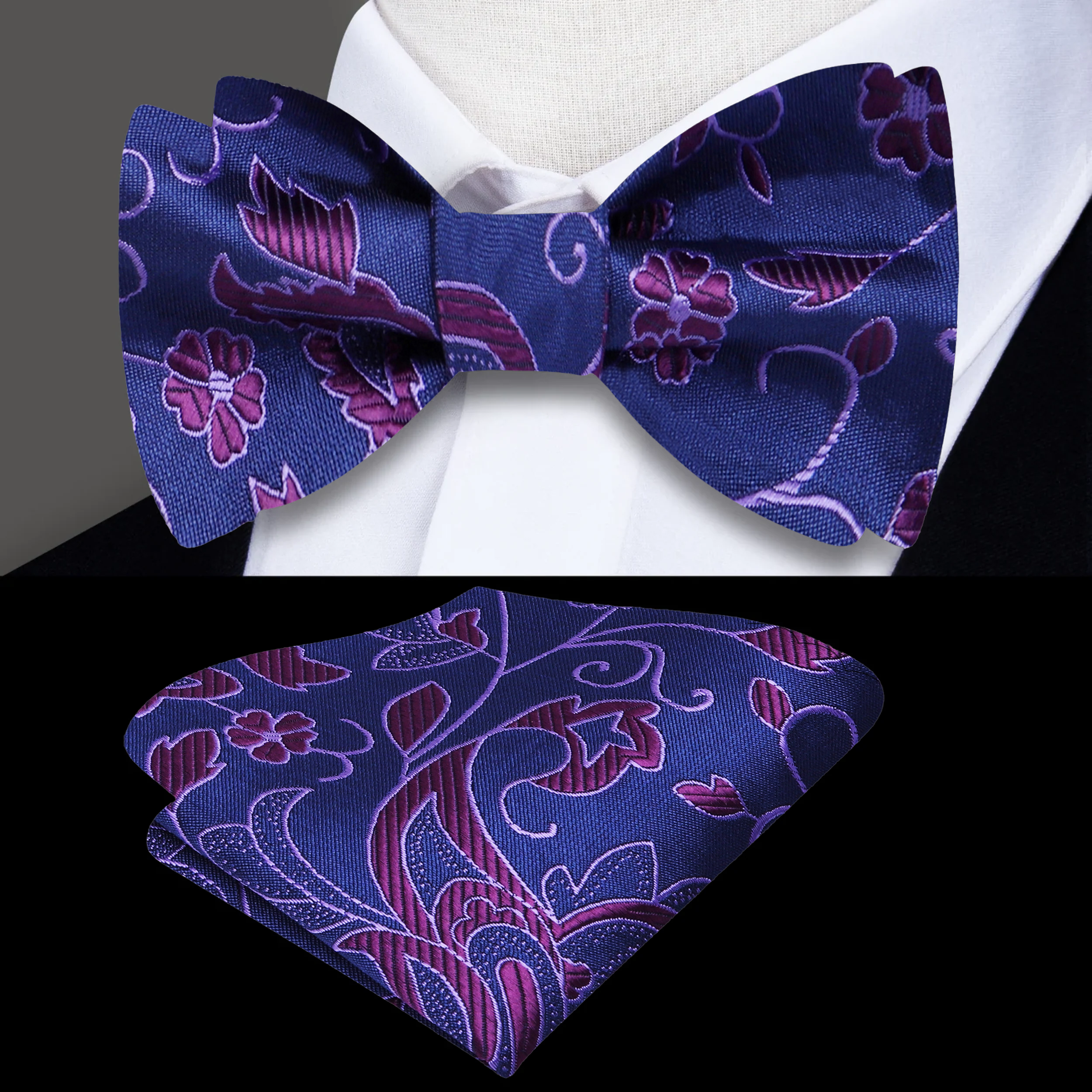 Model wearing a blue paisley silk bow tie paired with a navy suit