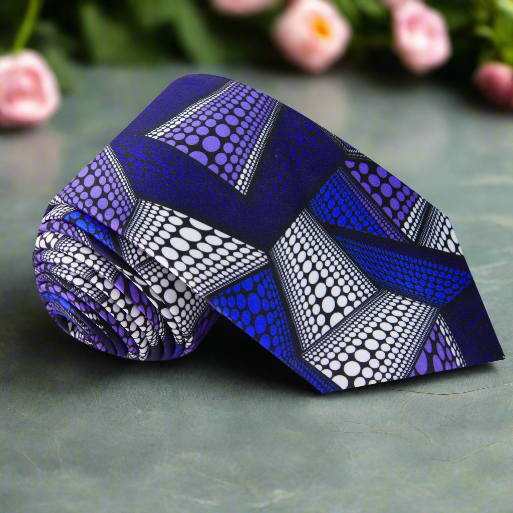 Celestial Harmony Abstract Necktie in dark blue, blue, purple, and white, displayed on a wooden surface.