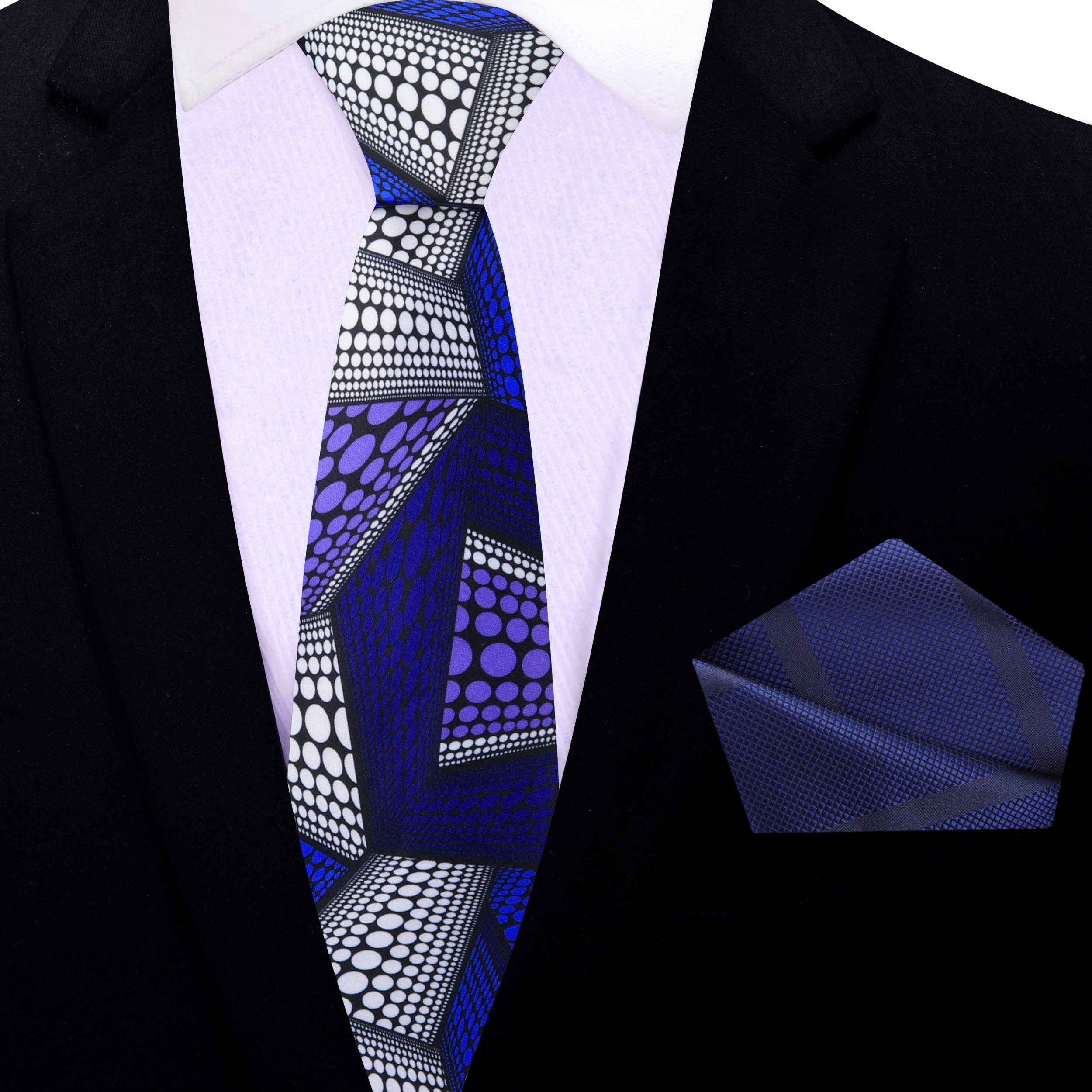 Celestial Harmony Necktie styled with a matching pocket square against a backdrop of a navy suit.
