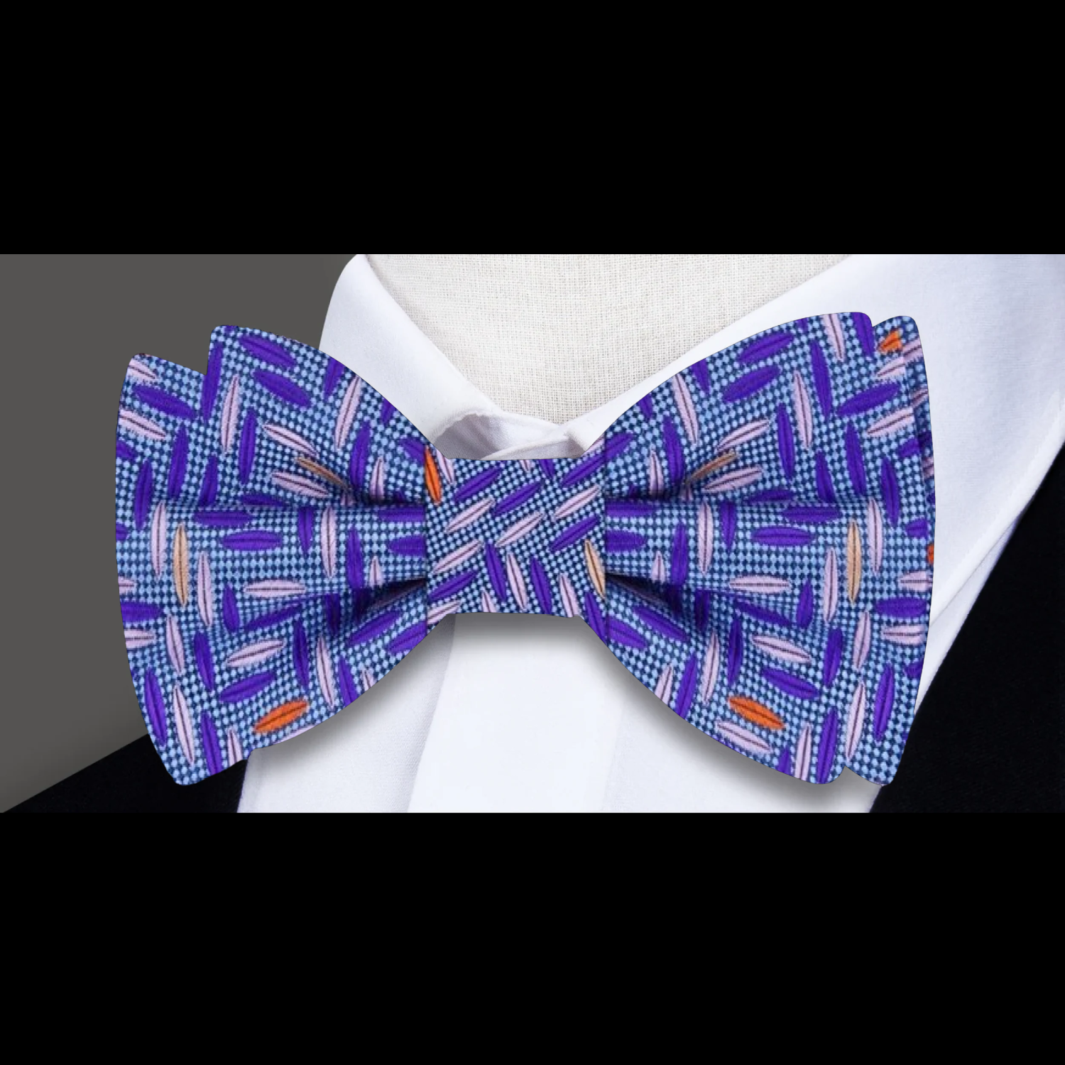 Styled with a crisp white shirt and navy suit for formal events