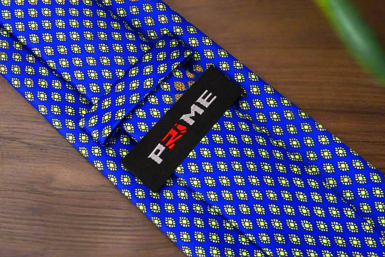 Flat lay showing tie and matching pocket square next to mens formal wear accessories online.