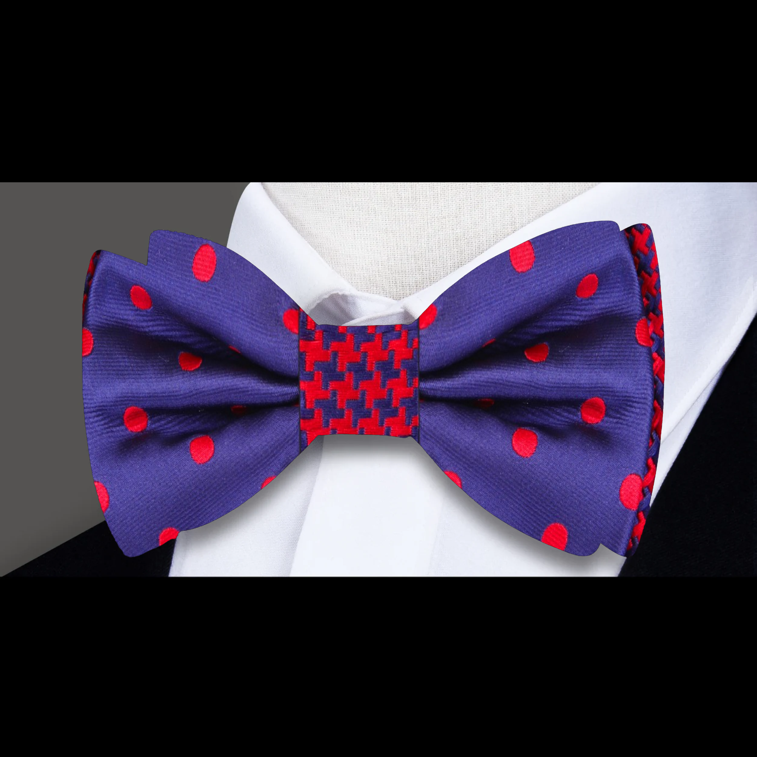 Close-up of Volt dual-pattern pre-tied bow tie showing polka dot and houndstooth patterns