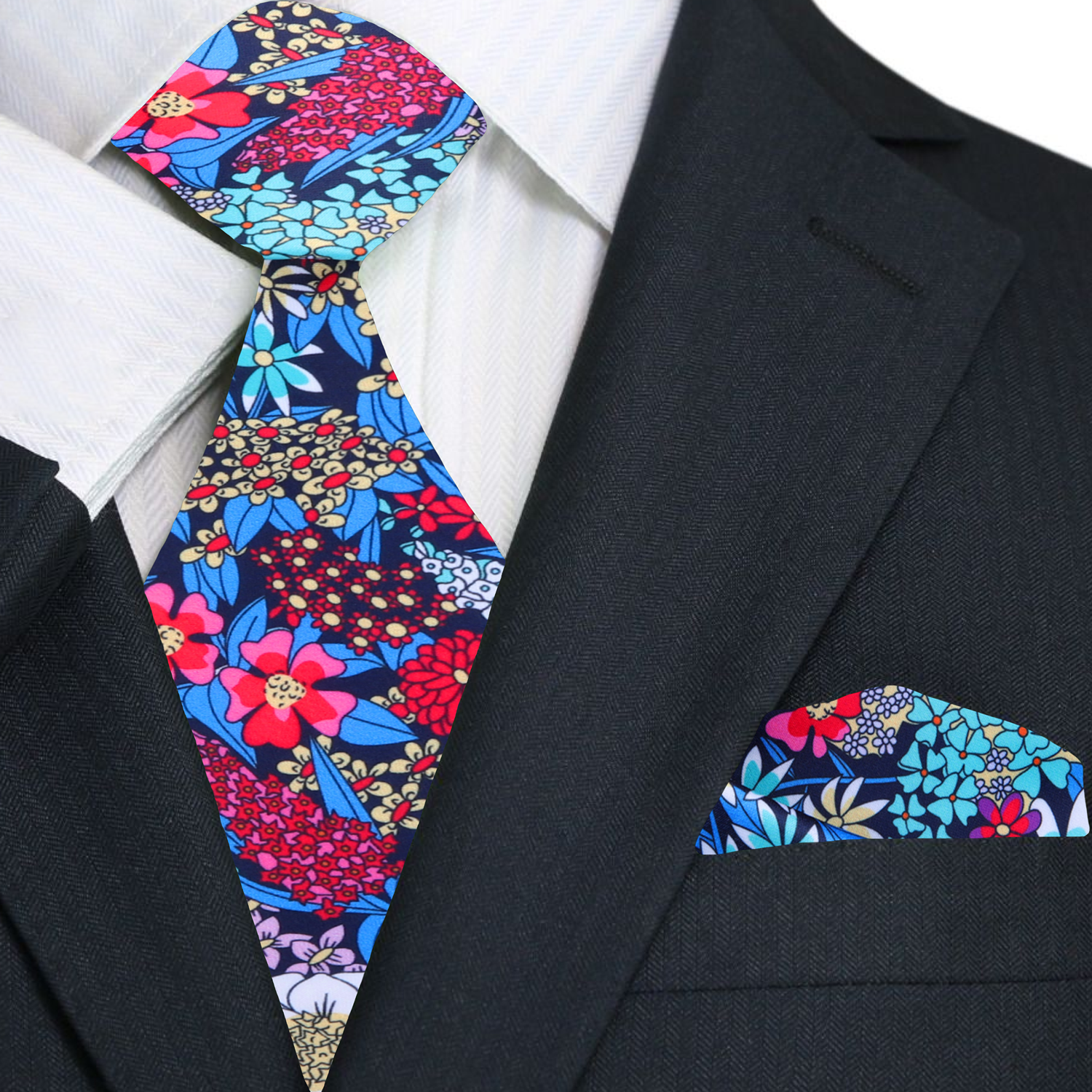 Man wearing floral necktie with a white dress shirt at outdoor wedding
