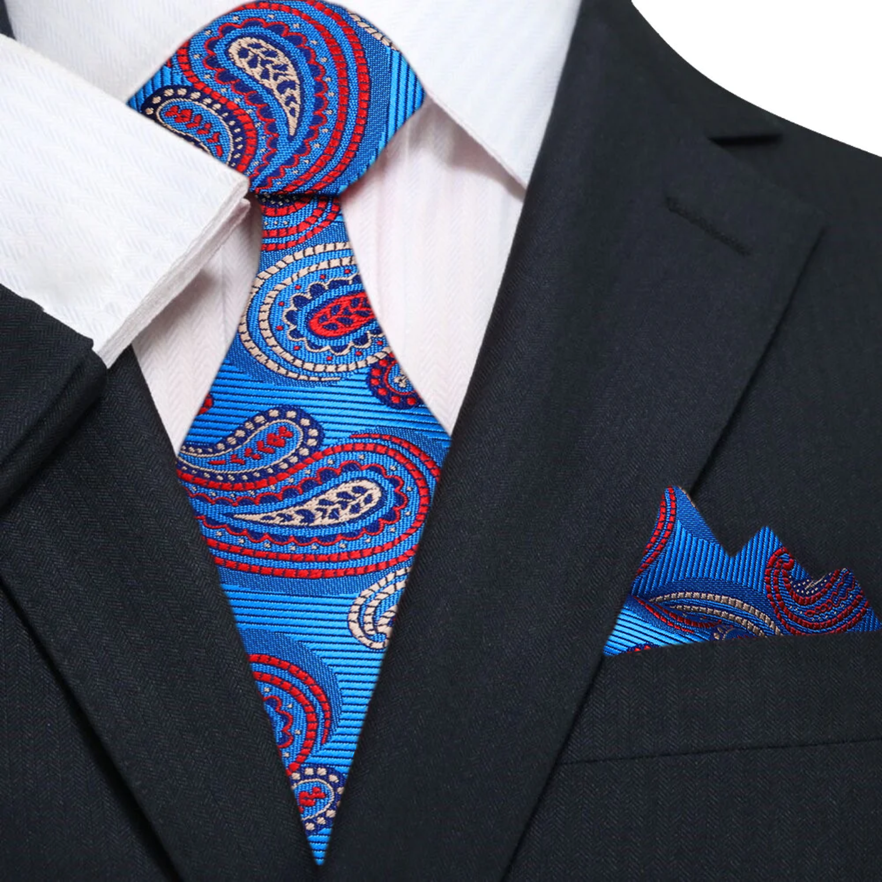 Model wearing a paisley silk tie with gold pattern paired with a white dress shirt