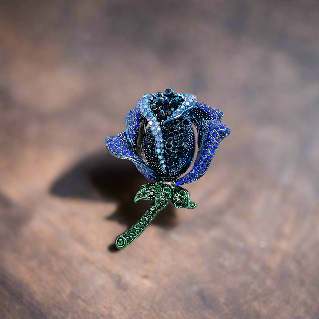 Elegant rose lapel pin in classic red, perfect for formal suits.