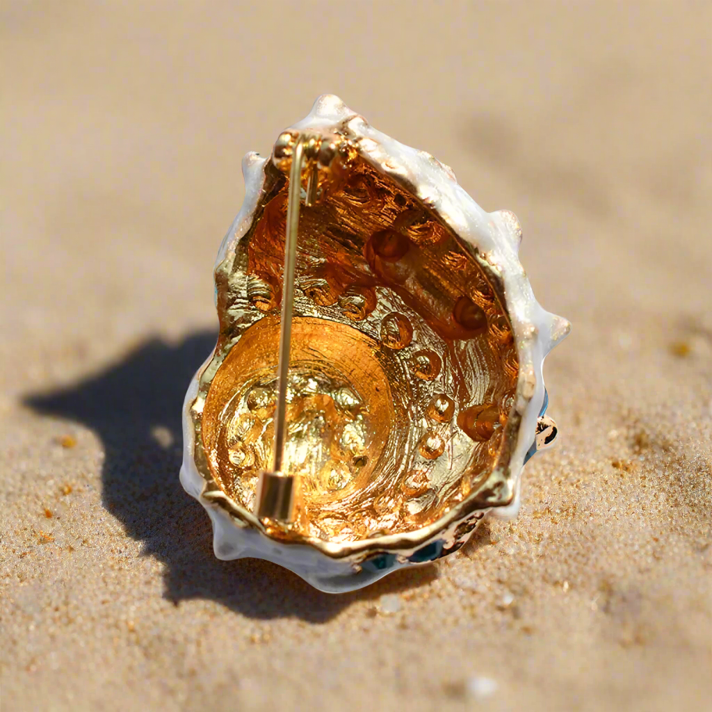 Nautical lapel pin worn on a blazer, highlighting its versatility for beach weddings and formal events.
