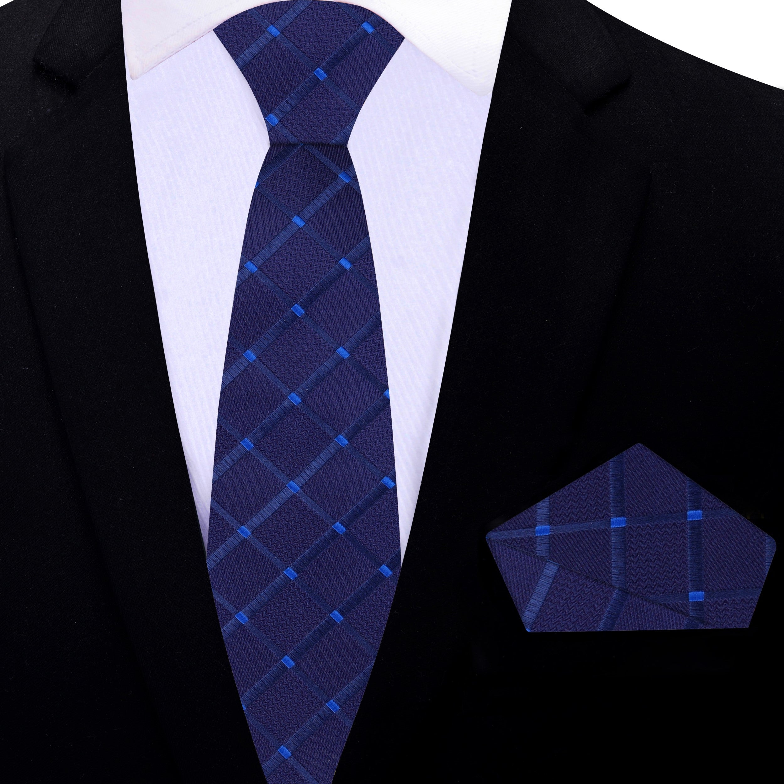Close-up of the geometric pattern on the mens dark blue necktie