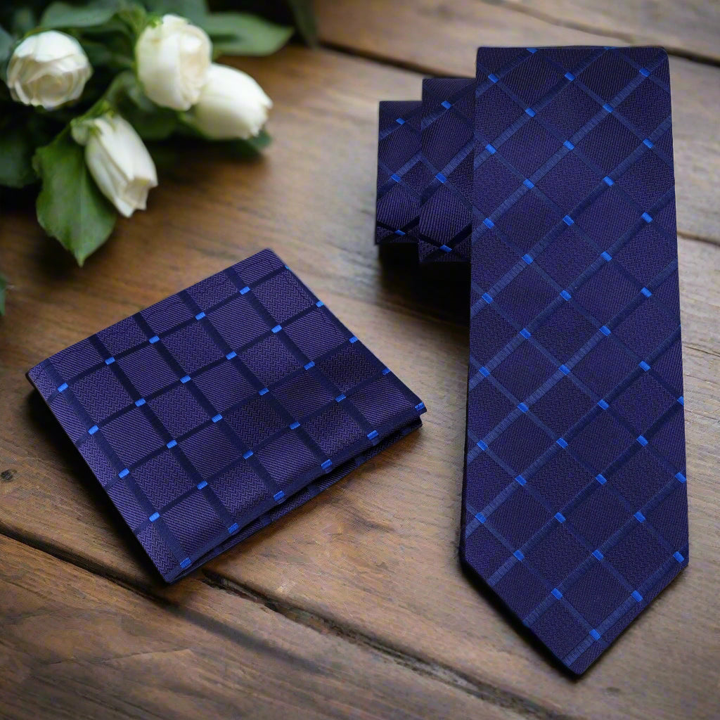 Dark blue geometric textured necktie styled with a suit for formal occasions
