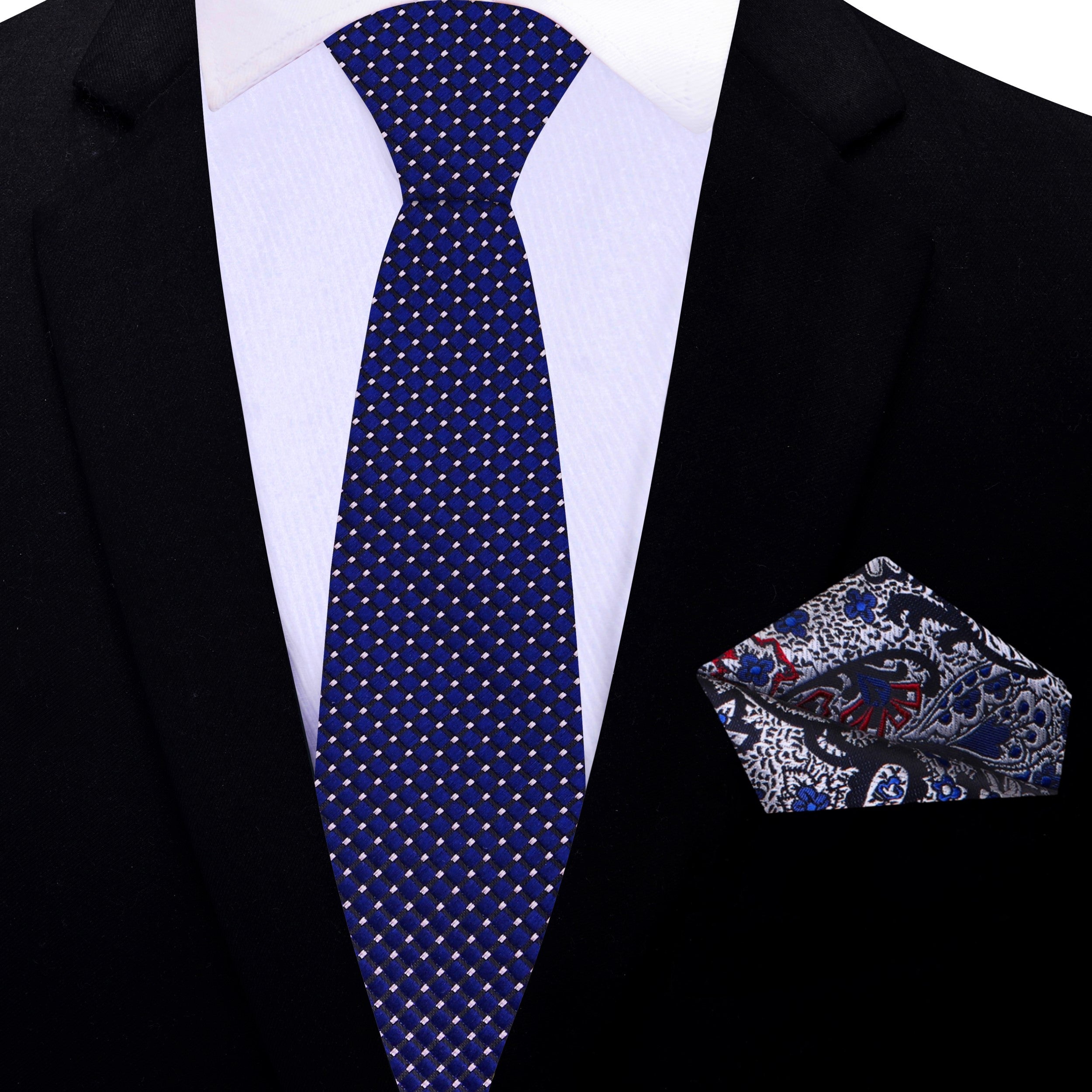 Professional setting featuring a man wearing the white checkered silk necktie for men, paired with a light blue dress shirt.