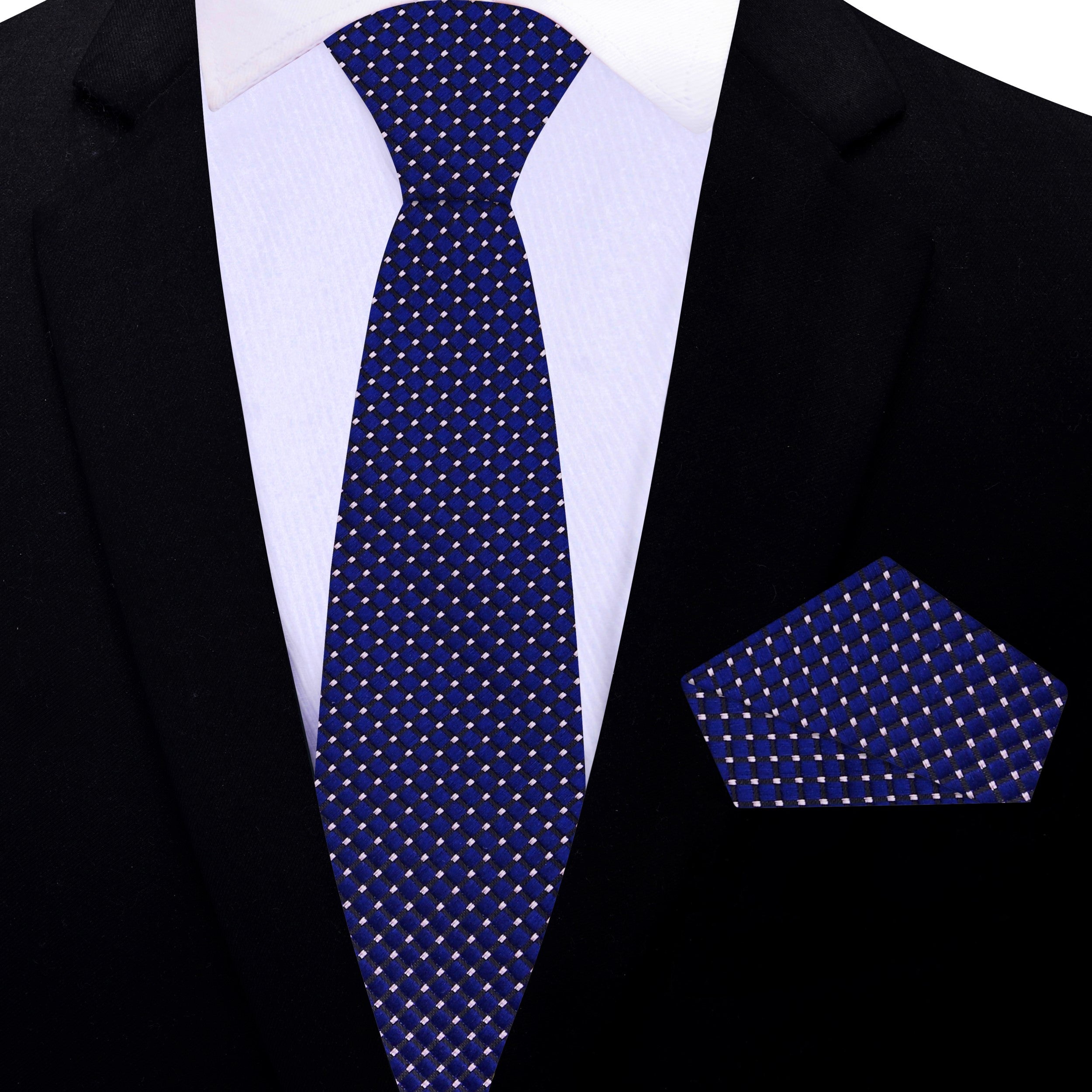 Professional setting featuring a man wearing the white checkered silk necktie for men, paired with a light blue dress shirt.