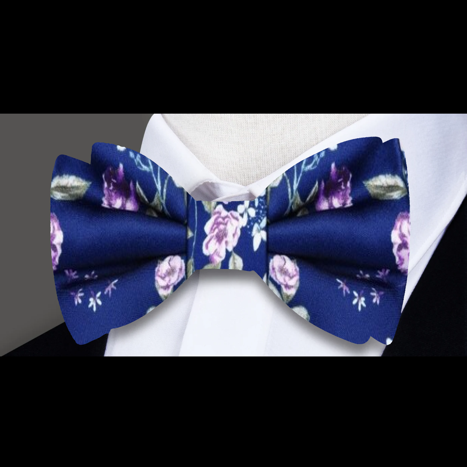 Still life-inspired bow tie styled with lavender shirt and charcoal suit