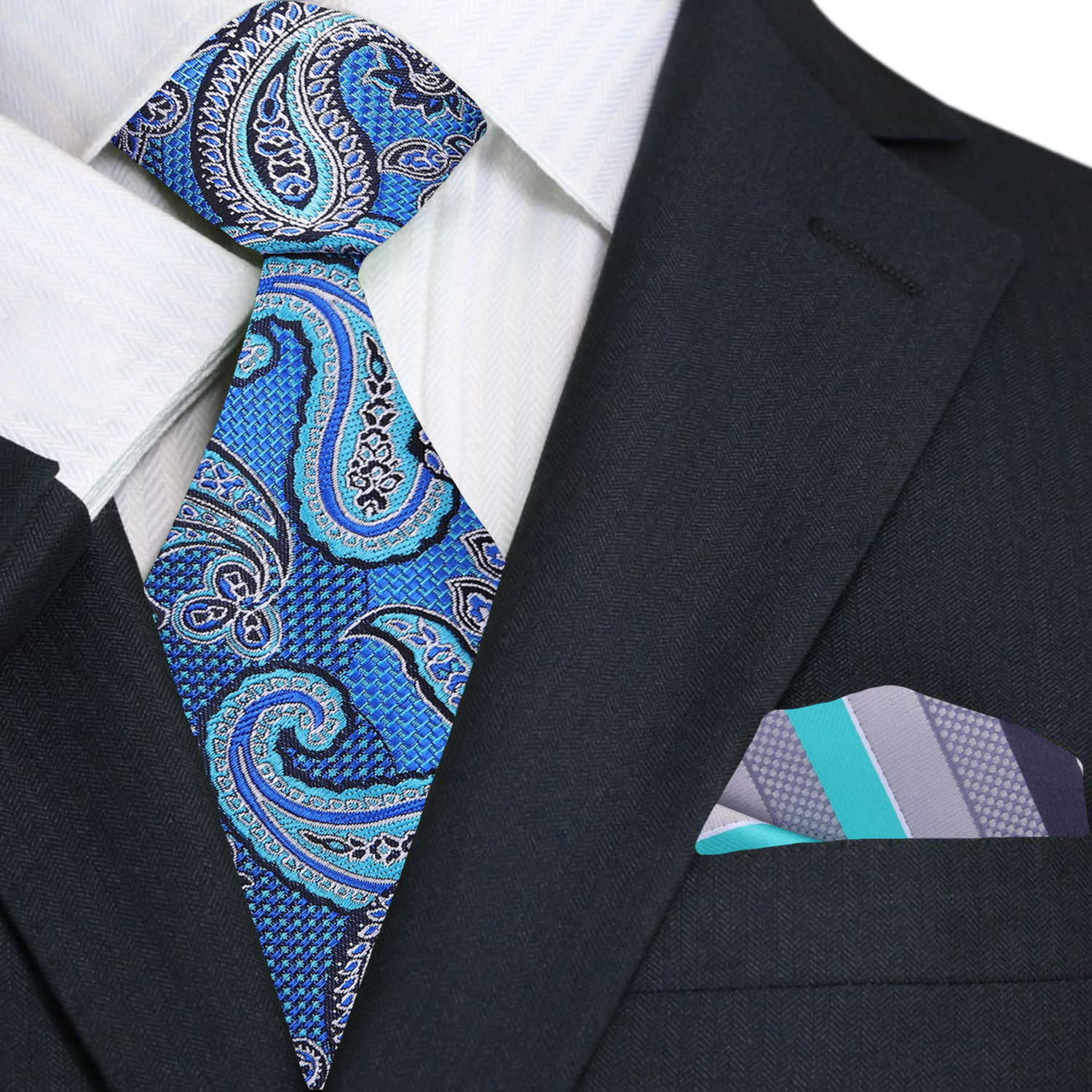Close-up of the red paisley necktie showcasing intricate patterns and rich colors