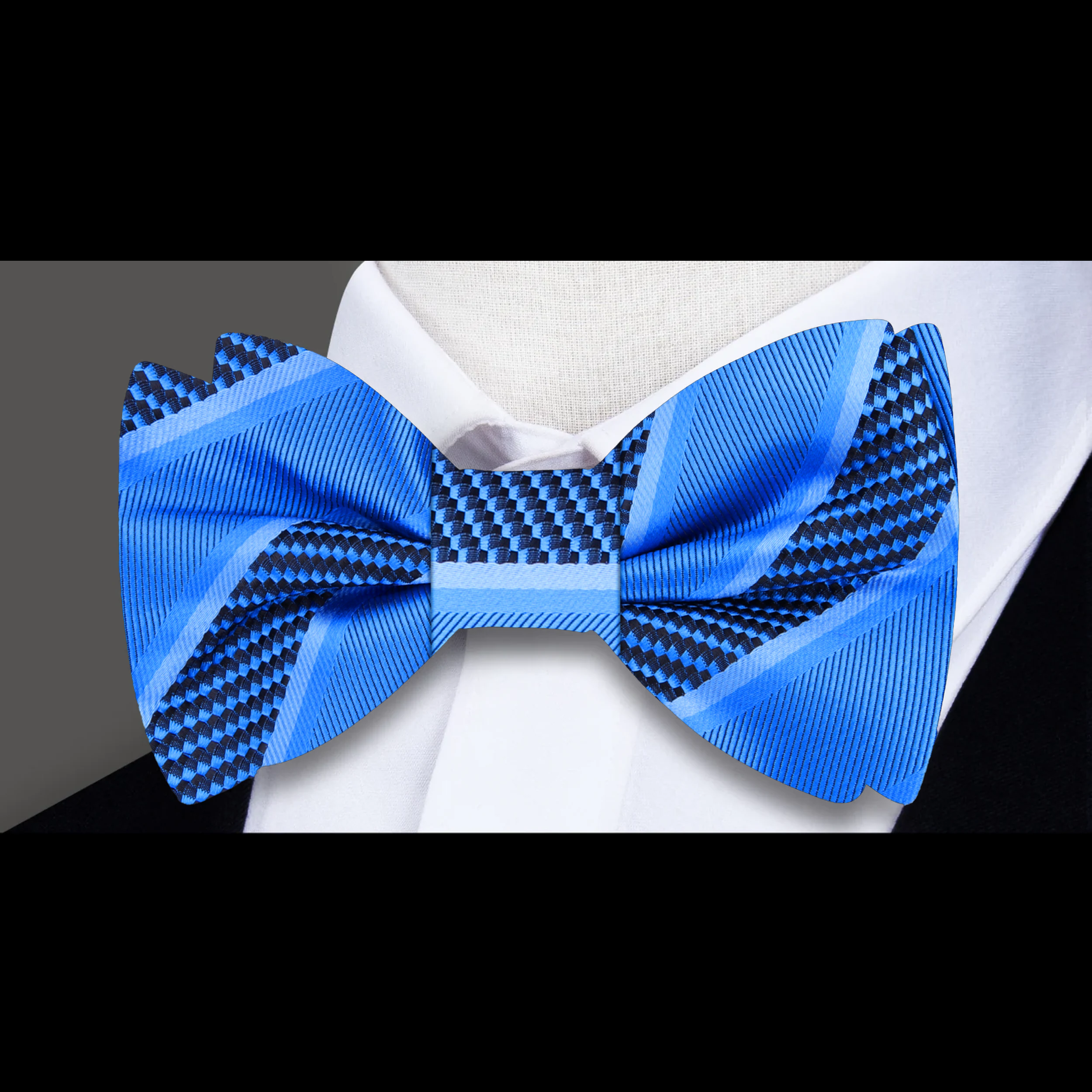 Close-up of the fabric pattern and texture of a yellow gold striped bow tie
