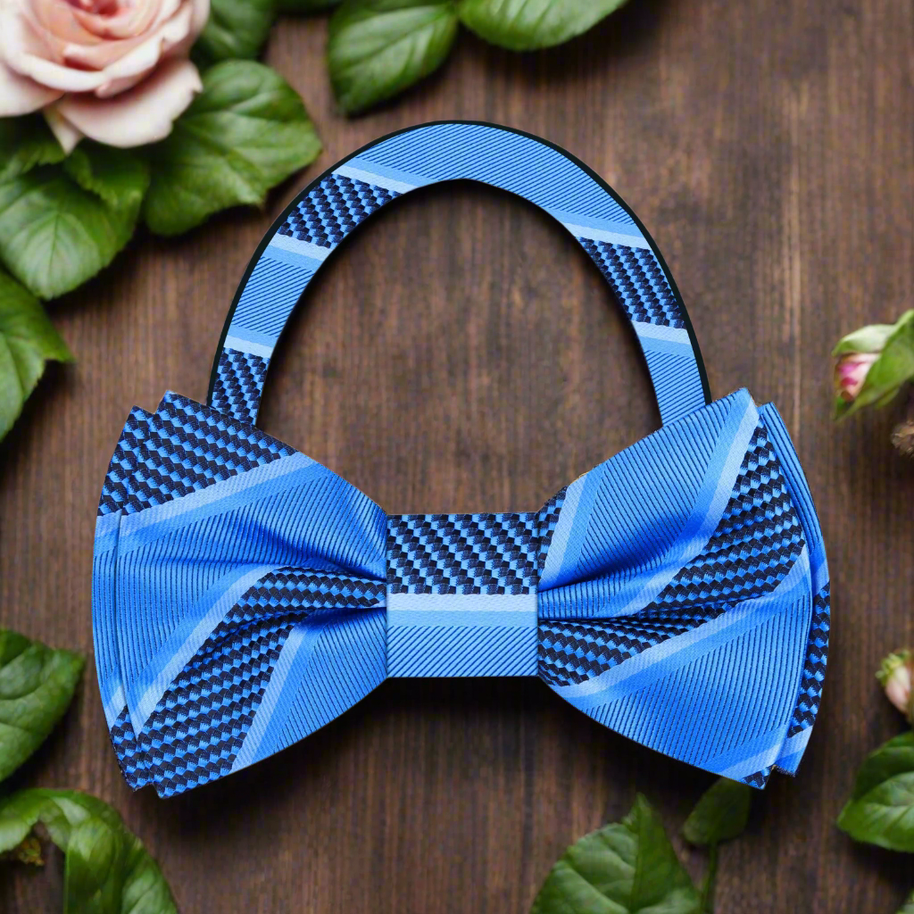 Model wearing a silk striped bow tie with a navy suit for a formal event