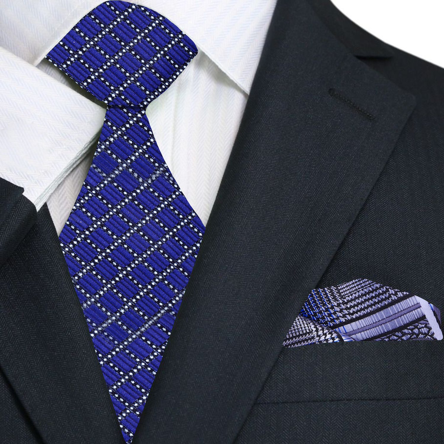 Styled silk tie shown on white dress shirt and charcoal suit jacket—classic business attire