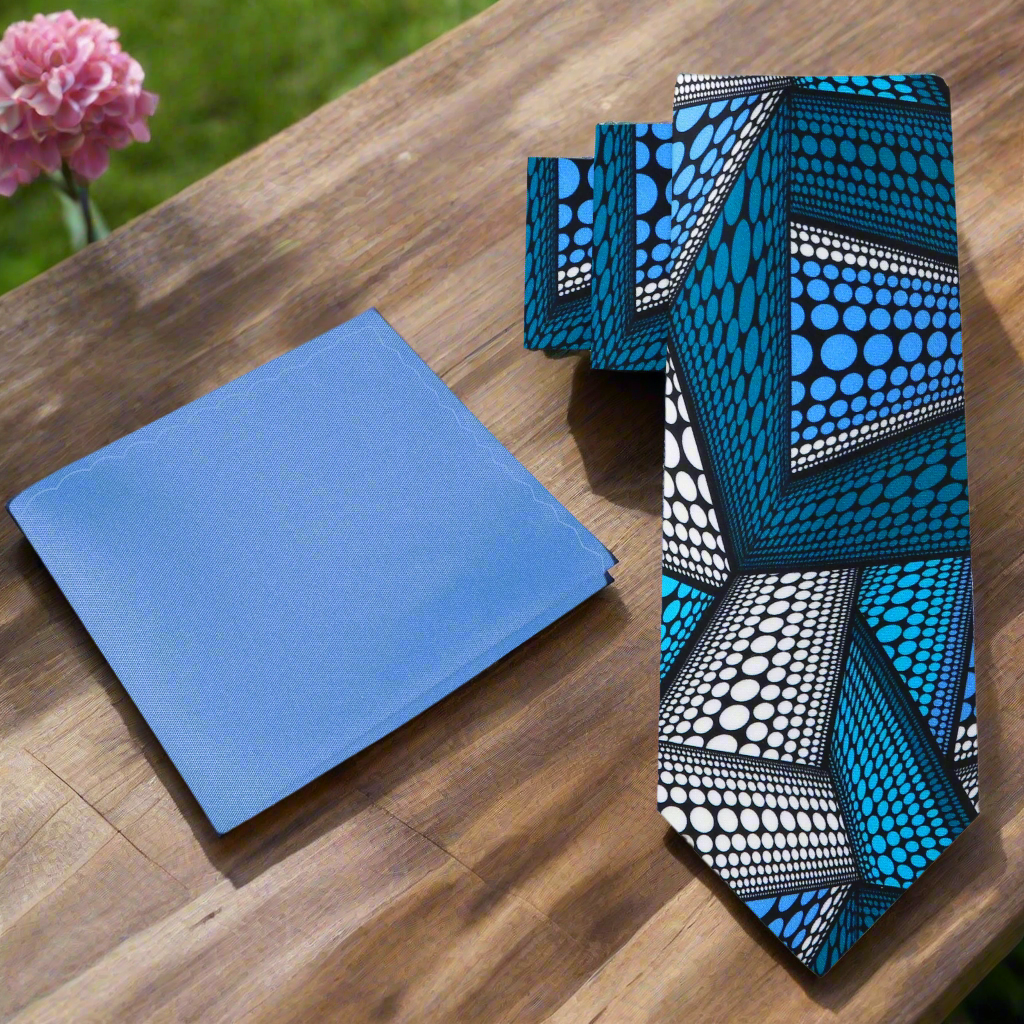 Close-up of Kente Elegance Necktie featuring intricate blue and white patterns.