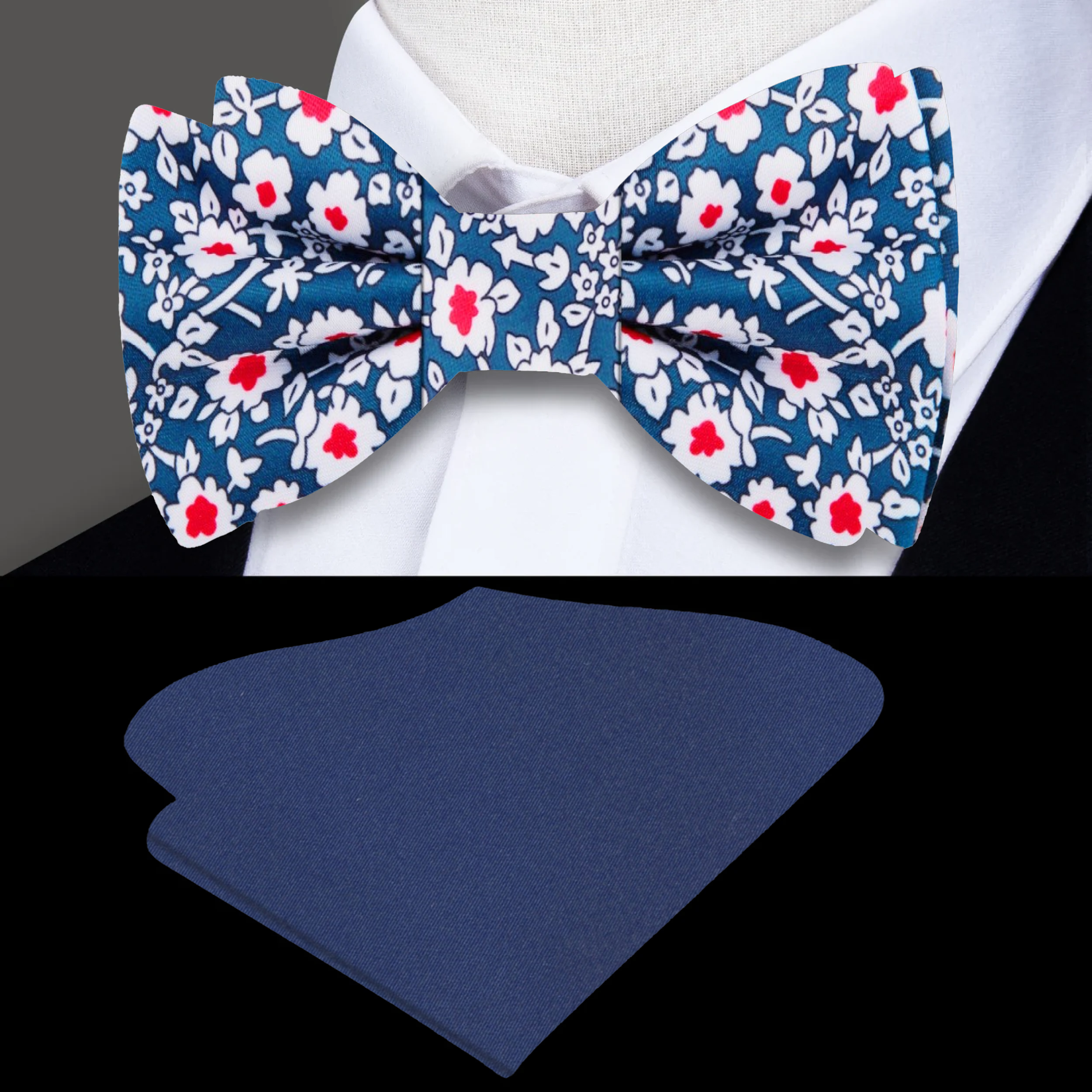 Close-up of the Midnight Bloom Silk Bow Tie showing red and white floral details on dark blue silk