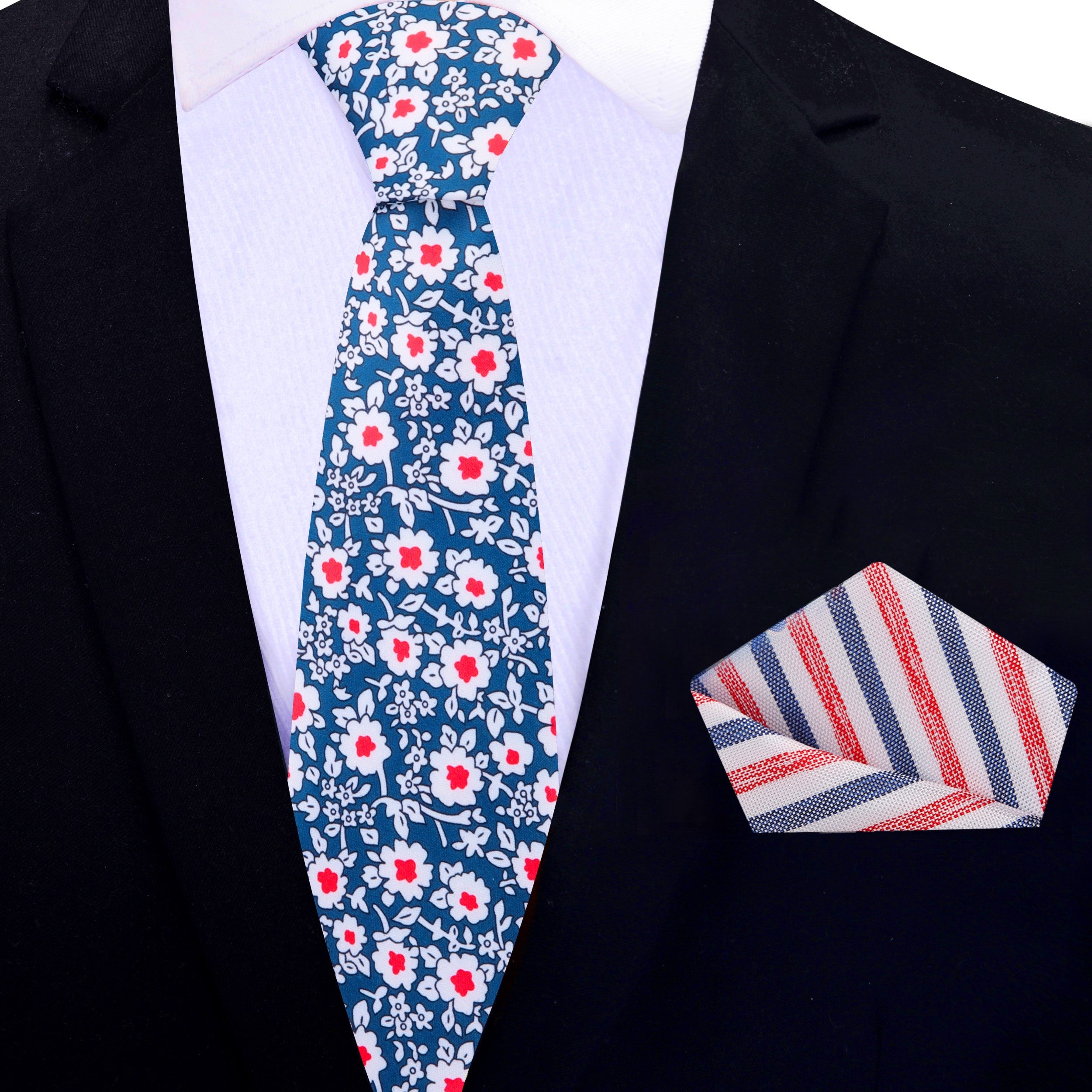 Model wearing the blue and red floral tie paired with a suit, demonstrating its suitability for formal occasions.