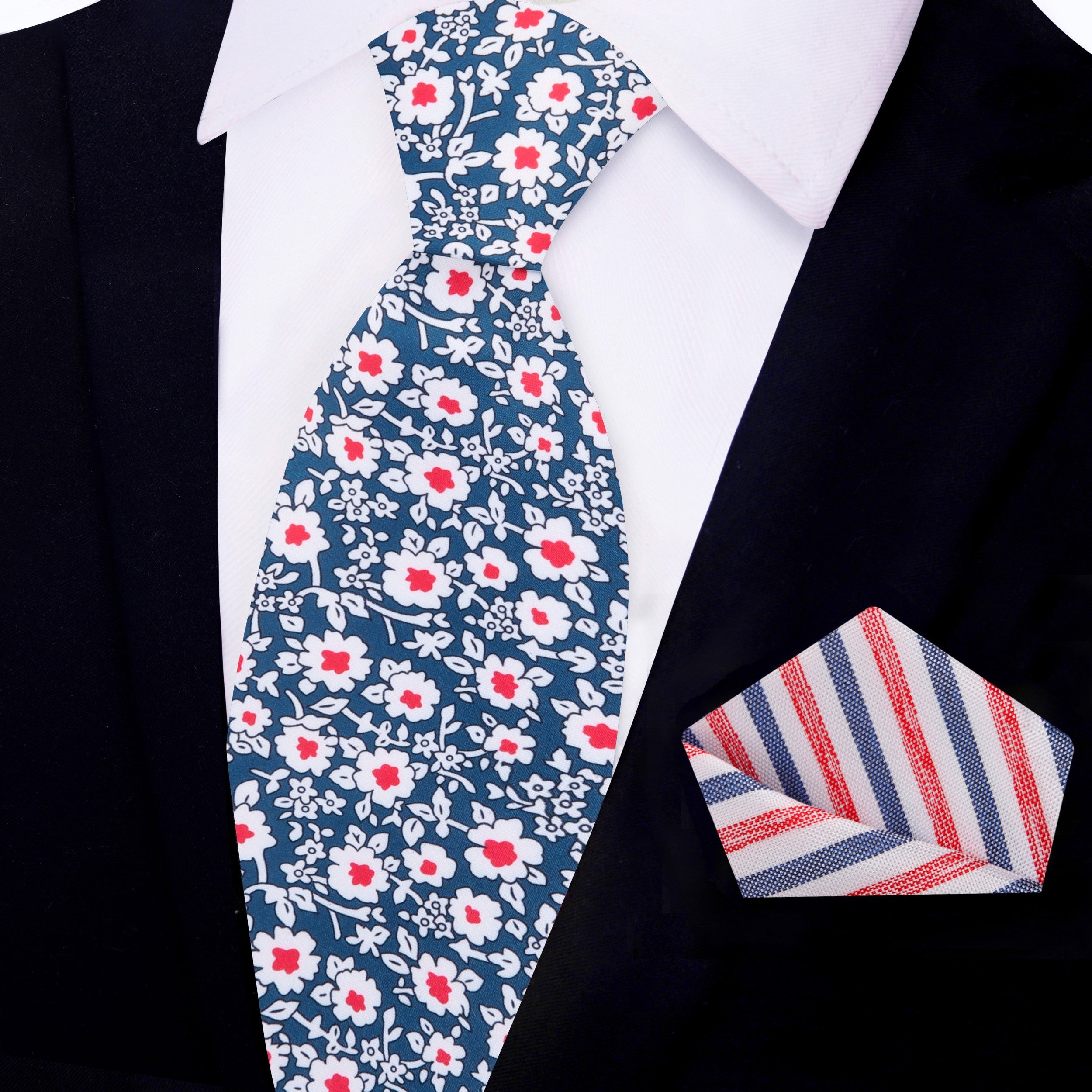Close-up of the elegant blue and red floral silk necktie showcasing intricate flower patterns, perfect for a wedding.