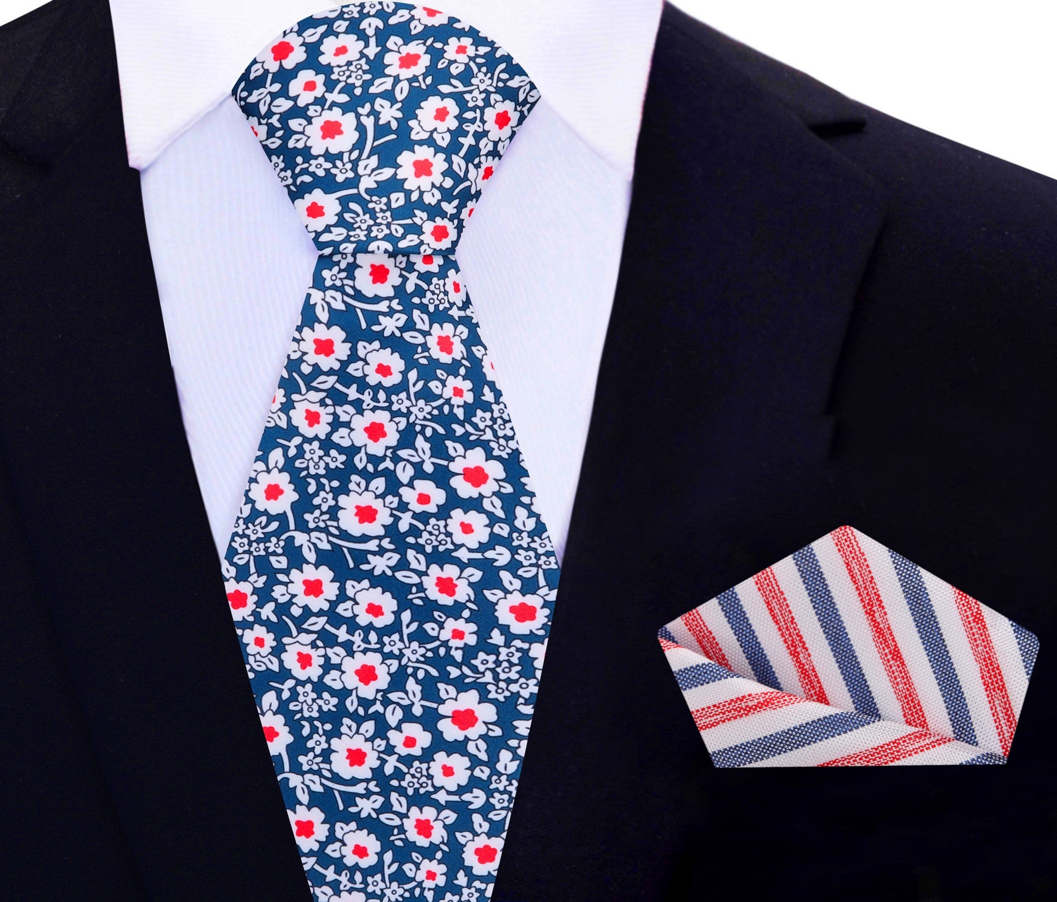 Detailed view of the matching pocket square, emphasizing the silk texture and floral design that complements the tie.