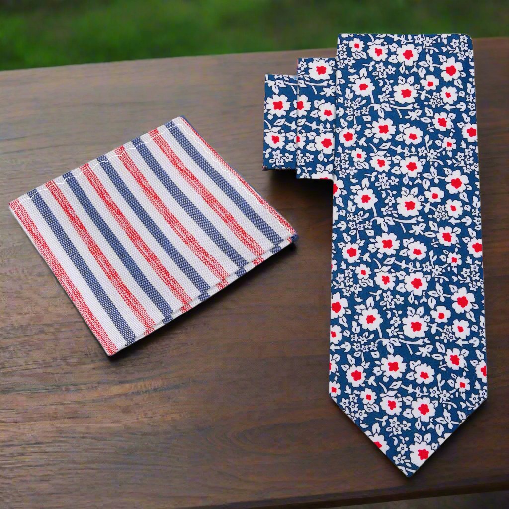 Detailed view of the matching pocket square, emphasizing the silk texture and floral design that complements the tie.
