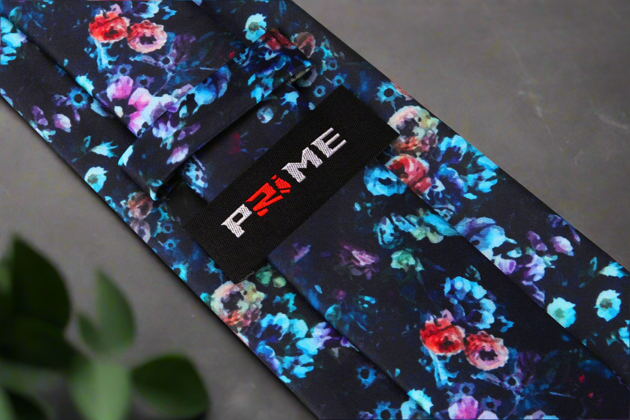 Close-up view of the artistic floral silk tie, highlighting the oil painting-style details and luxurious silk fabric.