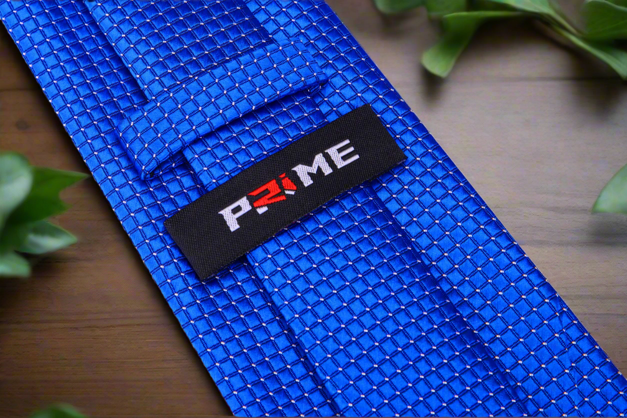 Flat lay of a blue checkered necktie with matching pocket square for office wear