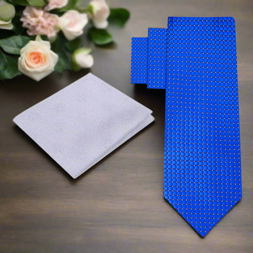 Flat lay of a blue checkered necktie with matching pocket square for office wear