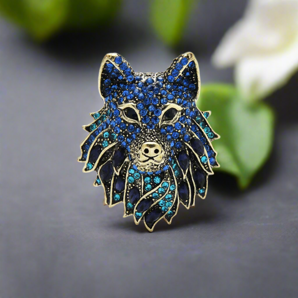 Close-up of detailed wolf head lapel pin in silver finish for men's suits